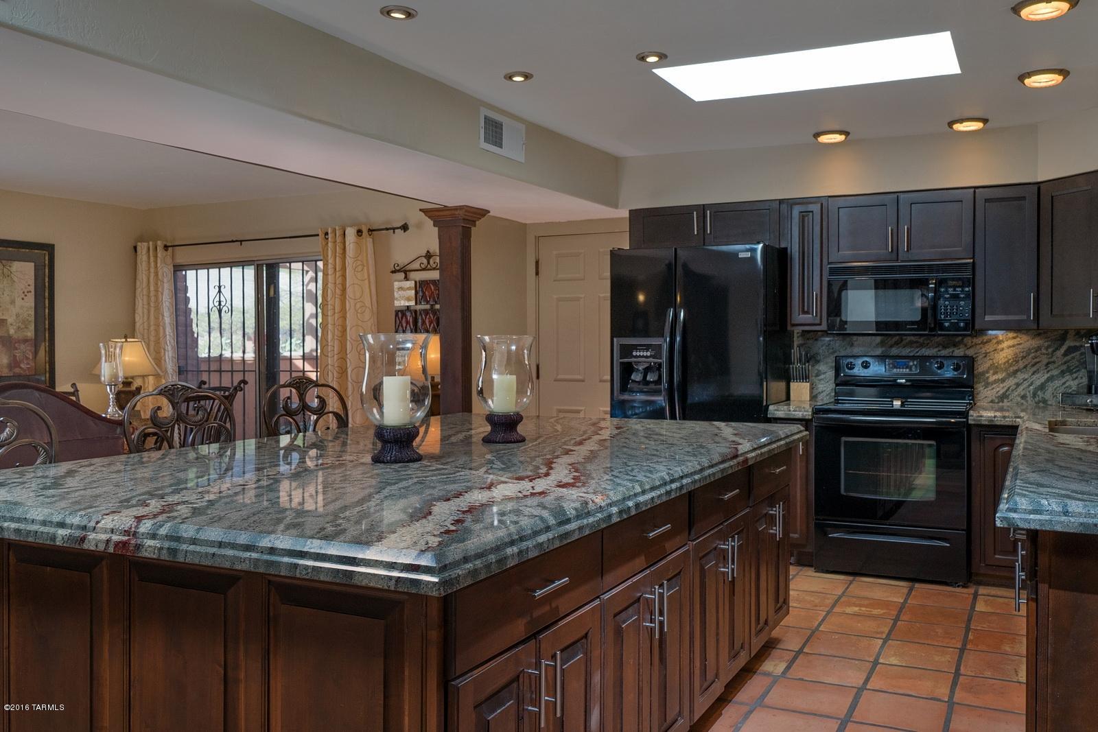 Seller will counter or accept offers between $269,900-$279,900. Wonderful home w/4 bedrooms 2.5 baths, pool, w/no HOA on .34 of an acre. Open concept w/remodeled kitchen with stunning granite that opens to the gourmet SPECTACULAR island..a showroom kitchen! Both baths remodeled w/the master having new fixtures, fossil limestone counters & granite surround shower. 4th bedroom/game room has its own bath. Living room has beam ceiling w/wood burning FP & granite surrounds. Family room has old world charm & elegant carver post accents & beam with its own door to courtyard where you can sit and enjoy beautiful mountain views. Large brick patio backyard w/pool, covered patio, raised flower beds, fire pit & lrg shade tree & irrigation system. New roof on 2 car carport & extended driveway holds 8 c Pool re-plaster and new pump & roof recoated. Pool was re-plastered in 2014, new pool pump in Feb 2016, and roof recoated in Feb 2016.