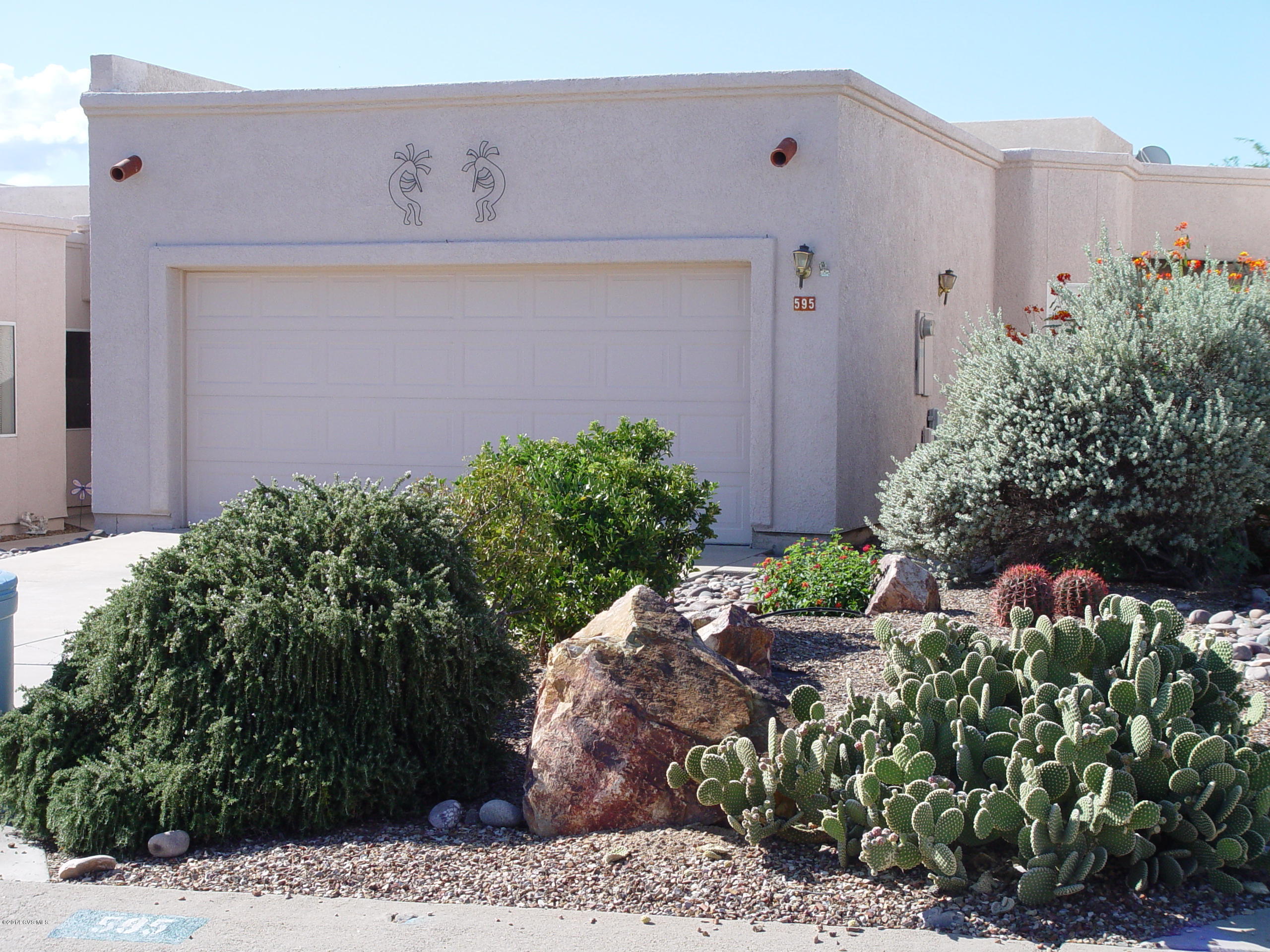 The Owner of this nice townhome has tiled and painted almost the entire home prior to putting it up for sale so you can move in and just enjoy the mountain view from the back patio which borders a wash and common space. You will also enjoy the eat-in kitchen or the sunlit, enclosed Arizona room with its view of the sunrise to start your day in this peaceful neighborhood. Buyers will love the spacious feeling enhanced by the tall ceilings and clerestory windows that make Dorn's SpringPointe homes so desirable. If light, airy, clean and lots of room and a view are what you are looking for, come visit this lovely home.