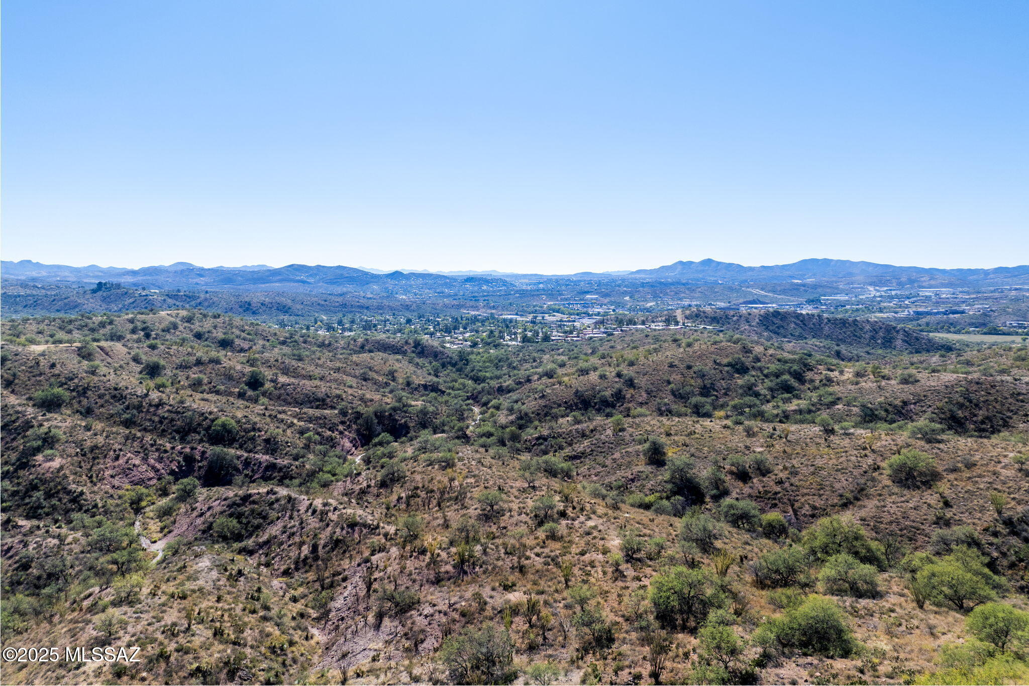 Welcome to Vista Del Cielo, one of Nogales, Ariona's most sought-after communities-where elegance meets tranquility. This 4.36-acre vacant lot offers breathtaking 360-degree views of rolling hills and endless skies, providing the perfect canvas for your dream custom home. Surrounded by beautifully crafted estates, this exclusive area is known for its high-end, custom-built residences and serene setting. Enjoy privacy, prestige, and panoramic beauty-all in one exceptional location.