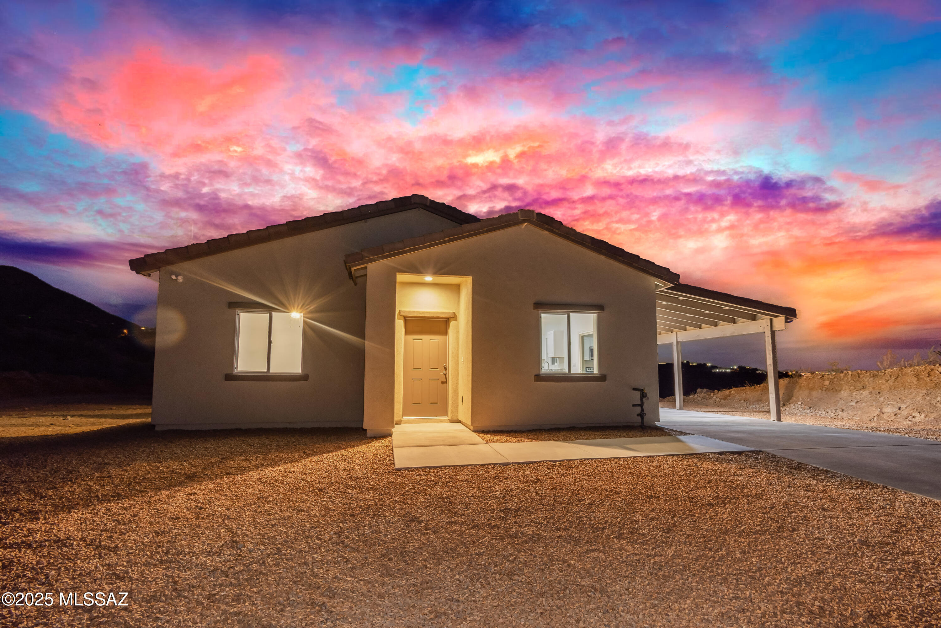 HOME QUALIFIES FOR 4.99% financing with preferred lender, which translates to hundreds of dollars of savings monthly, ask me for details!! Home also qualifies for USDA/0% down! Beautiful new construction, turn-key ready home! Come view this well laid out open floor plan that includes an open kitchen, living room.  Kitchen features new stainless-steel appliances, granite counters and a neutral color palette. This home is equipped with 3 bedrooms, 2 bathrooms and no HOA and located off a paved road. All bedrooms have a very spacious feel with tile throughout, and they also all have ceiling fans already installed. Theres is sweeping mountain views from every direction. Home is located a few miles from I-19 making it a very easy commute to Tucson, Nogales and surrounding areas. Call me to schedule your showing today, Rio Rico still leads the area when it comes to affordable housing!