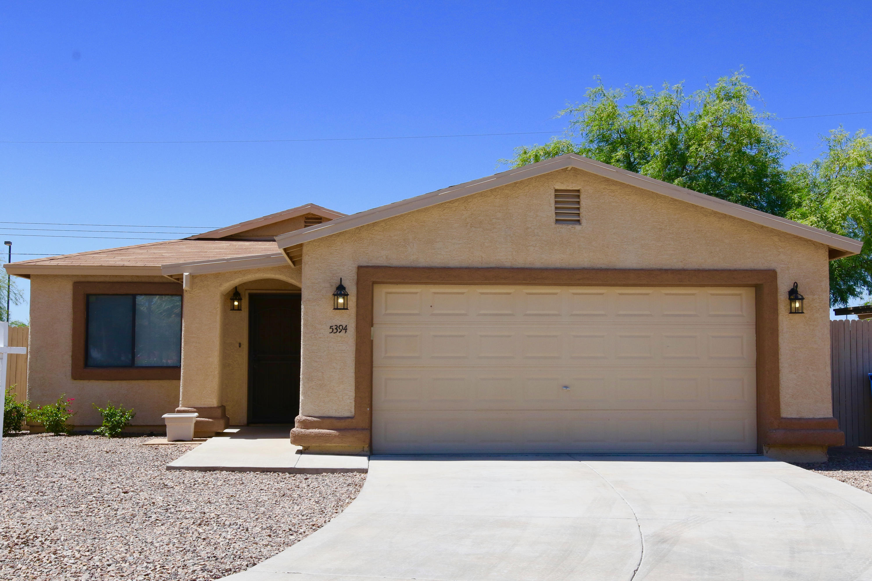 Beautiful 3 BR/2 Bath home with plenty of space inside and out.  MOVE IN READY.  Bright open floorplan.   Neutral palette to satisfy any decorating  style.  Kitchen newly redone, baths upgraded with all new fixtures.  New paint throughout.  Wrap around yard fully fenced in.  Terrific central location.  Close to shopping, Davis Monthan, parks, and public transportation.