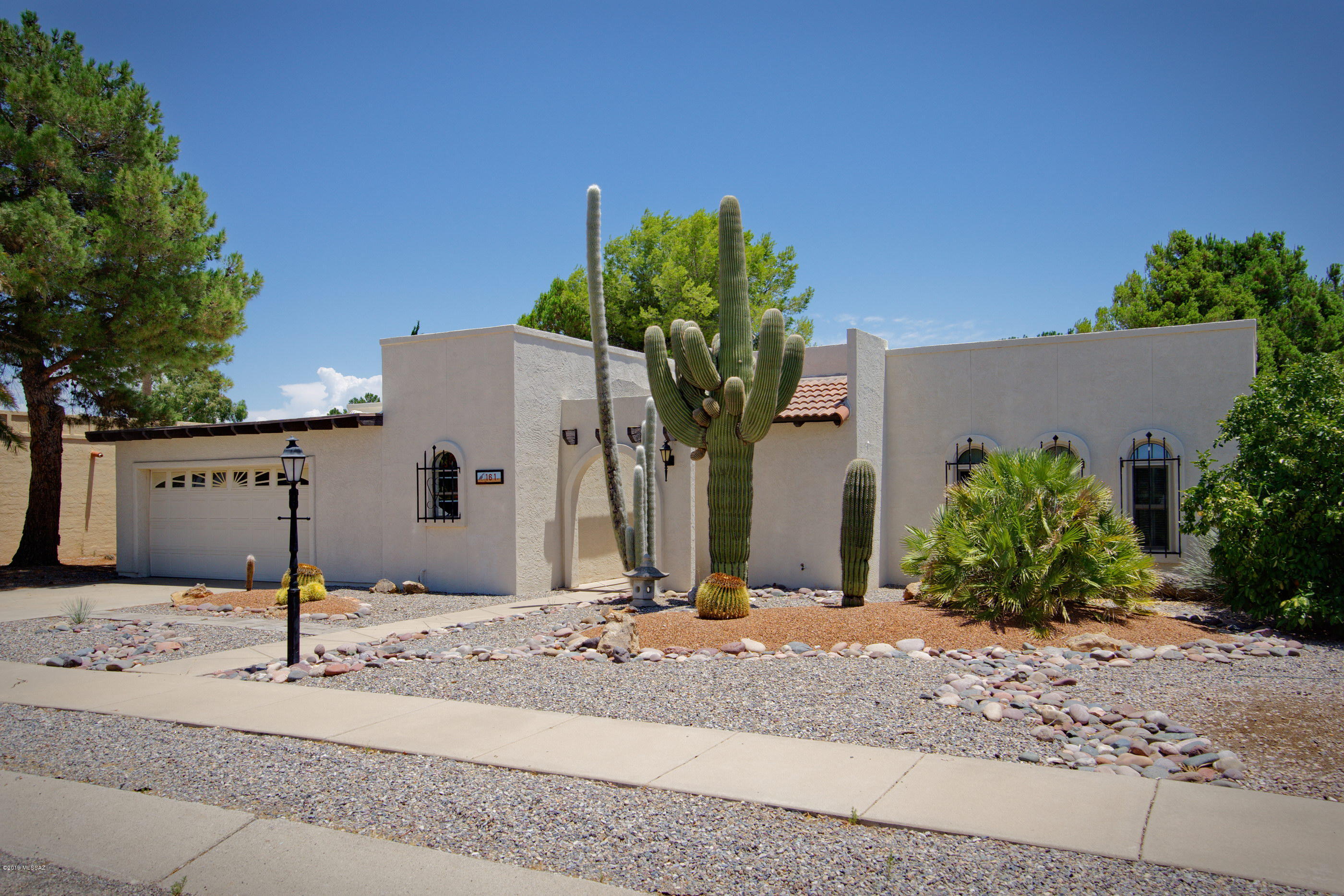 Centrally located in Green Valley and on the course of Green Valley Country Club!  Sit on the east facing patio and enjoy the tranquil backdrop of the Santa Rita Mountains.  The patio includes a built-in barbecue and mini fridge for those cold beverages!  From the patio you have access to the greenhouse but you can use it as a workshop, studio - whatever suits your needs! The interior of the 2243 SF home provides updated cherry cabinets with soft close doors & drawers and beautiful granite countertops. Seller is offering a closing credit of $5,000  for carpet, paint or other necessary changes deemed necessary.