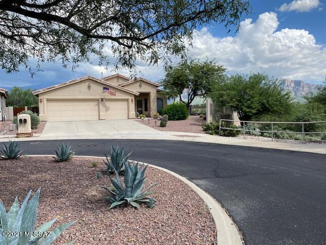 WOW! If you want mountain views, this is your new home! Rear, side and front yards have Southern & Eastern exposure and a view fence with unobstructed mountain views. Property abuts HOA common area which abuts Honeybee Canyon. Custom hardscape in rear yard includes heated & jetted pebbletech spool, beehive fireplace with banco seating, flagstone terrace, covered patio.  Installed Pentair pump and cartridge filter, handrail for spool in 2018. Roomy interior w/ amazing views as well. 4 BR or 3 + Den. Remodeled Kitchen w/slab granite, quarter-sawn oak cabinets w/pullouts, island, breakfast area, slider to covered patio and breathtaking outdoors.  Covered Front Entry w/security door opens to Formal Living/Dining Room. Family Room off of Kitchen w/Gas Fireplace, raised Hearth. Raised Ceilings & Doors throughout. Remodeled Master BR Suite w/Double Doors, more views! Cherry cabinets w/tower, dual vanities, walk-in shower w/teak folding seat. Private toilet area w/additional cabinet. 4th BR/Den w/Glass French Doors from LR plus door to hallway. 2 additional Bedrooms, Hall Bath w/tub, dual vanities, Linen closet. Laundry Room and 3 car garage (only one of three single story homes in the neighborhood with a 3 car garage)  Don't miss photo #42!!