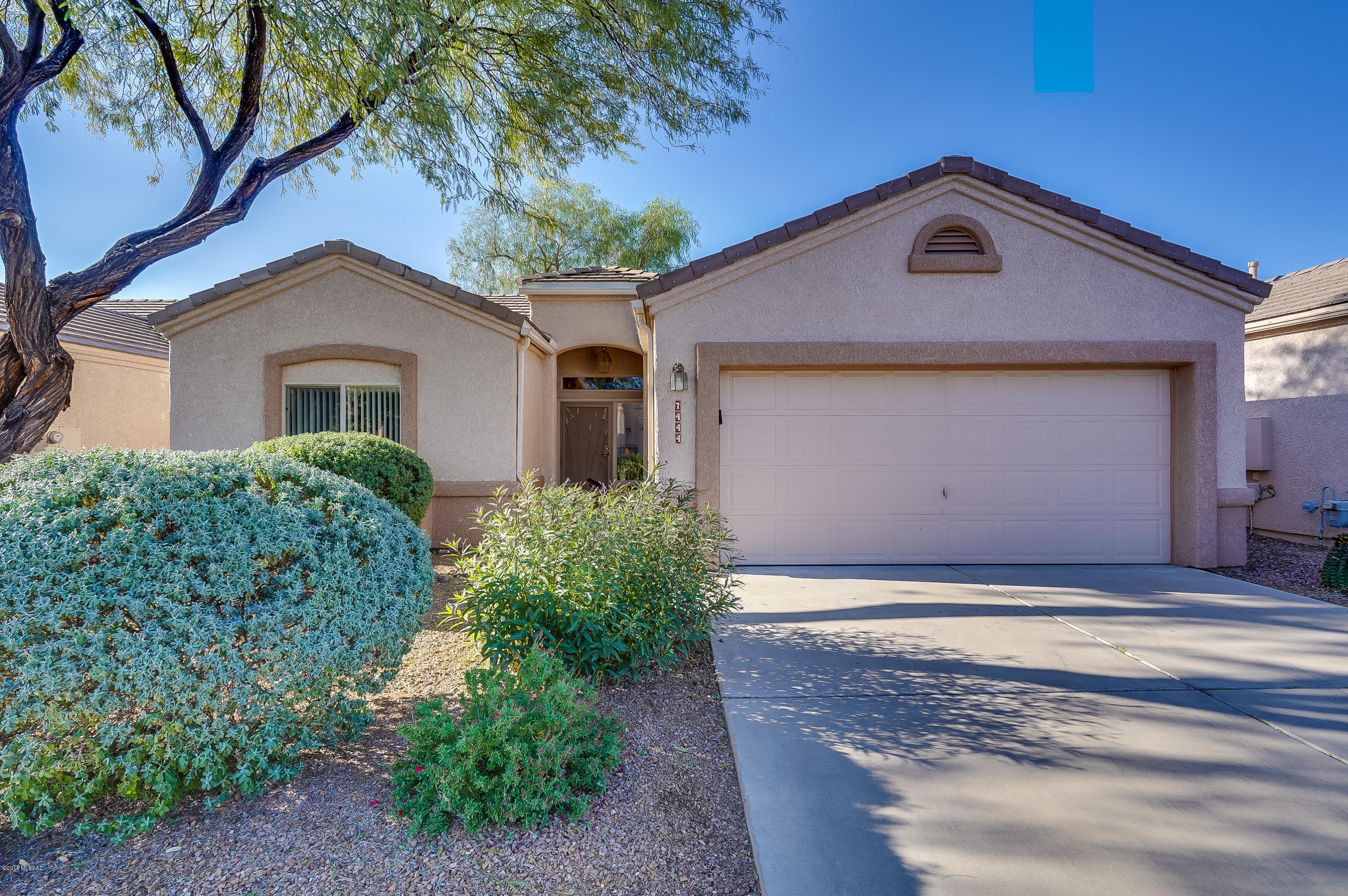 Lovely two-bedroom two-bath home with tile flooring throughout and Arizona room with floor to ceiling windows  in back area. NEW ROOF in 2016 with warranty; newer hot water heater and garbage disposal. Kitchen has maple cabinets, upgraded Formica countertops, lazy susan and pullout shelves. Some other features include ceiling fans, water softener and two-car garage. Located in gated 55+ community convenient to I-10 and access to adjacent Voyager RV Resort, with with all its activities and amenities, including pools, spas, pickleball, restaurant, day spa, classes, fitness center, crafts, entertainment, and much, much more. Come and enjoy the ultimate in active adult living.