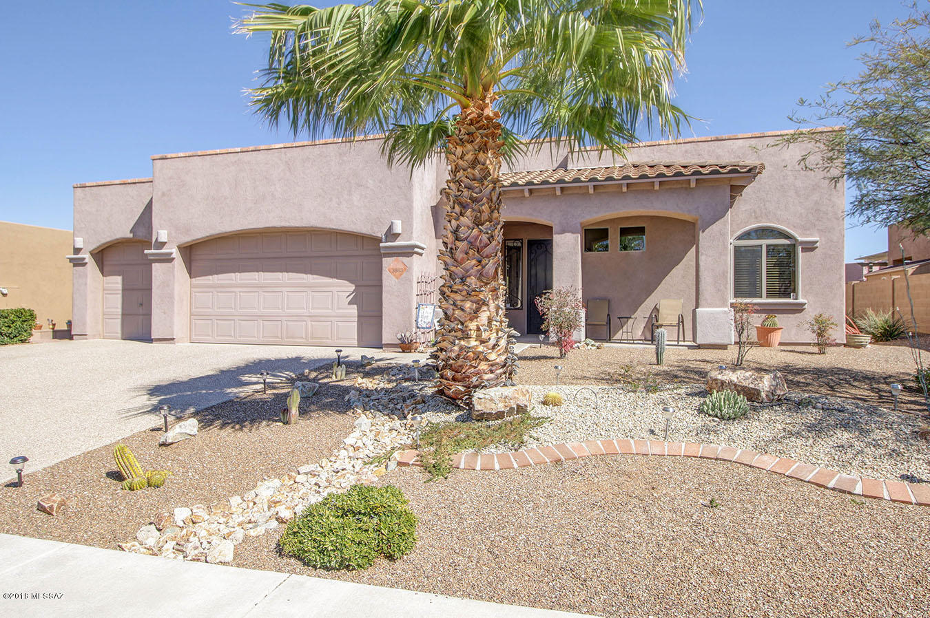 Home is like BRAND NEW!  Very well maintained with every custom feature you would want in your home. Kitchen has granite counters with Stainless Steel appliances, decorative back splash many Cherry cabinets that include an extended buffet. Granite High top island for seating. This Open Floor plan has 20'' tile floors with custom inlay design, 10' ceilings in all rooms. Great Room consist of beautiful light from the Large windows and has a gas fireplace.  Spacious Master Suite that has its own entrance to the backyard.  Master Bathroom has a large soaking tub, walk in closet with custom built in drawers and shelves. Backyard is an Entertainment Paradise with a Large covered patio, Brick pavers, Stone Custom Fountain and a Hot Tub with a gazebo.  The Landscaping is breath taking! Must See!