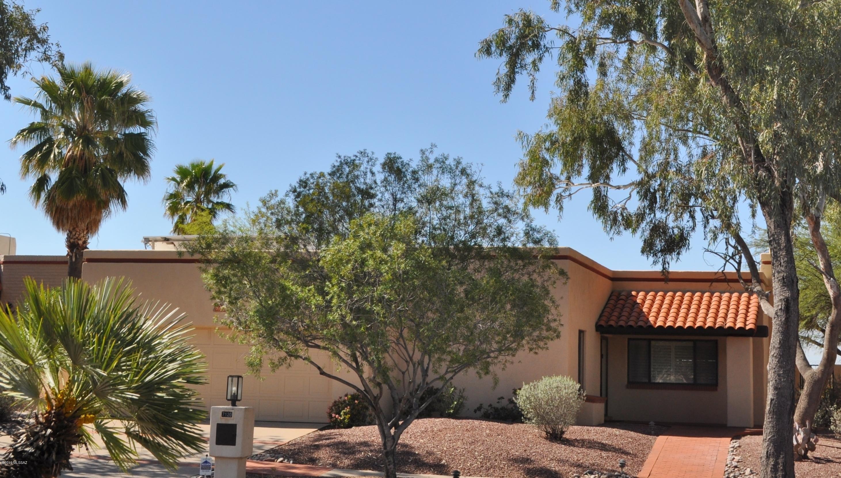 Beautiful well maintained home in beautiful neighborhood.  You will love the open brightness of this home. Everything in turn key condition.  Just bring your toothbrush! Many upgrades including a 21+ Lennox heating/AC unit w/3-phase Pureair cleaning system; NASA tested thermal barrier roof.  Totally owned Solar World 16-panel PV system made in USA; UV barrier window film and total irrigation system replaced for the best ''green''& energy efficiency available.  The garden, designed with raised beds. Expanded patio for entertaining.  Inside, beamed ceilings, Saltillo tile floors.  Mexican tile in both baths.  Murphy bed and built-in office in 3rd bedroom; skylights & lots of storage/wall cabinets in laundry room.  Mountain Views from family room.  Mature Grapefruit, Orange and Lemon trees