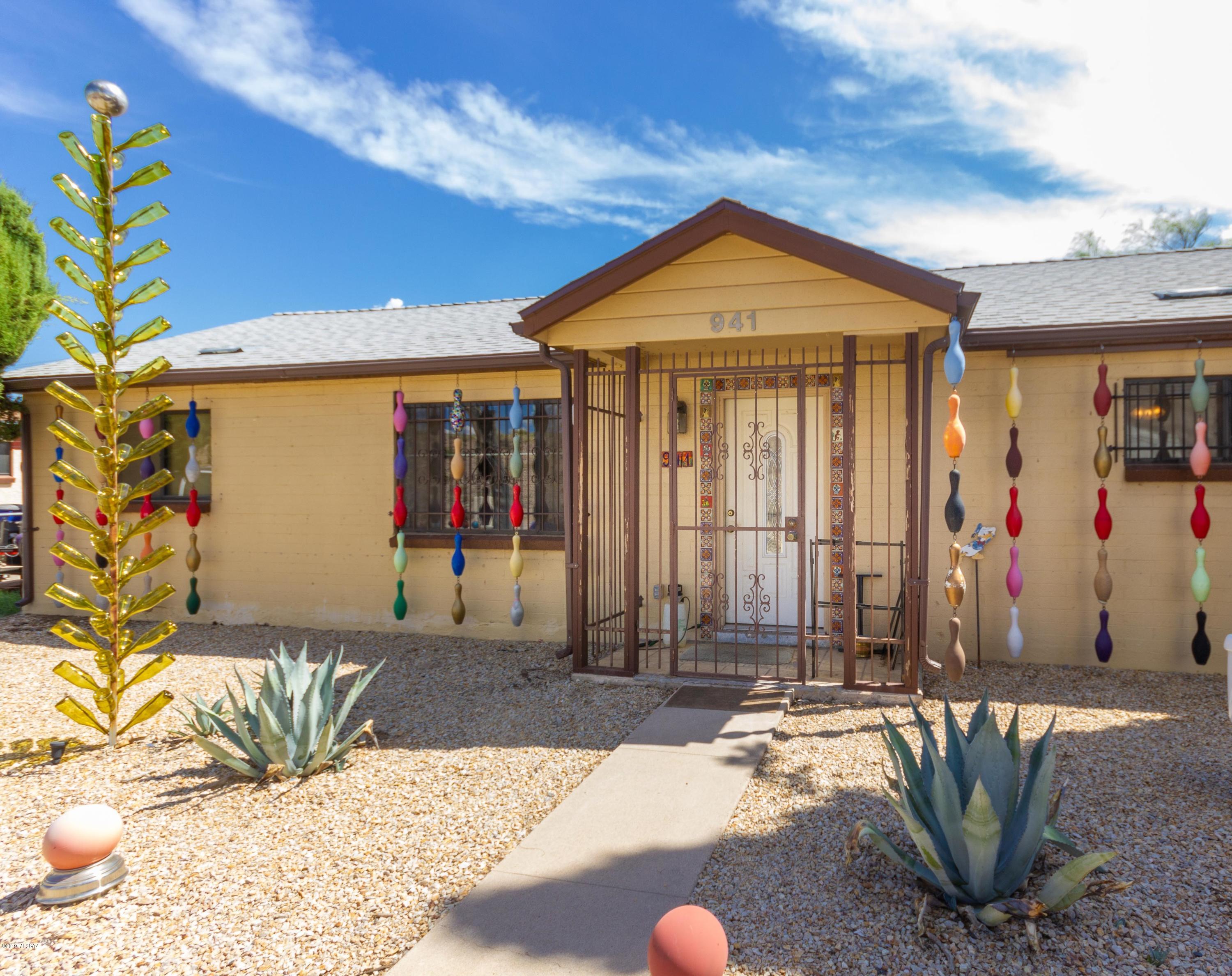 Come see this quaint with a little touch of whimsical home nestled in the heart for the up and about southern side of town. With a charming exterior, you are invited into this cozy home with a dash of Mexico in mind from Talavera hand painted tiles adorning the front door to the kitchen back-splash and more. This home has 3 spacious rooms. Two bedrooms tot he west end of the home and the master to the east end of the home with its spacious bathroom with some retro pieces here and there. As you pass the kitchen with a customized eat in kitchen bar with updated counters and cabinets, you step out into the spacious back yard sure to be enough for wonderful family and friends gathering with plenty of space for seating with a little extra unexpected area; a decommissioned pool with decking from the highest steps to the entire floor of what was the pool allowing for your imagination to make a little tropical oasis and entertaining area in addition to the spacious yard. Wait wait, there is more, enjoy a great work area / storage unit perfect for all the tools, gadgets, ends and odds. This home sure is a looker with lots to offer.