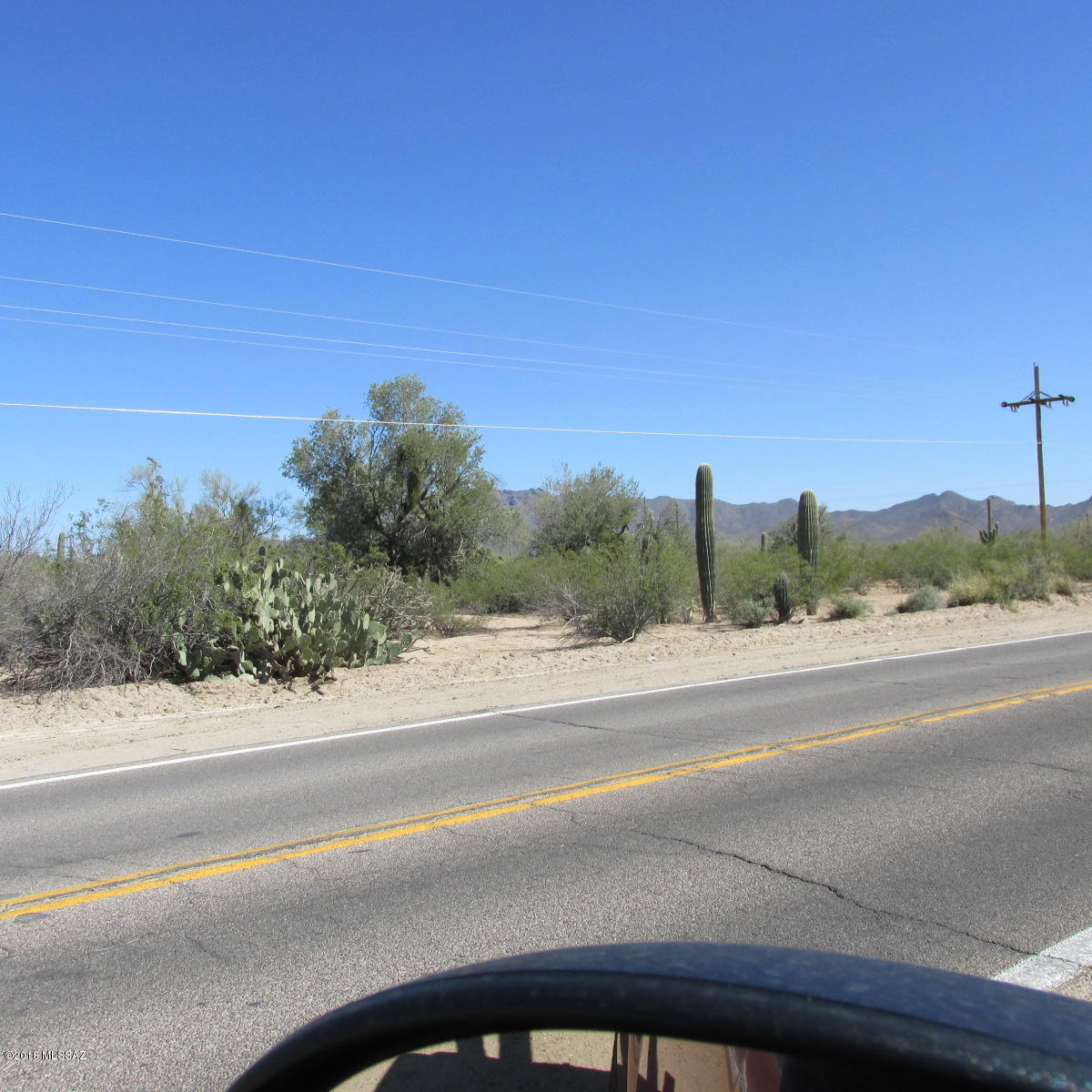 NICE 1.86 ACRE PARCEL, 200 FT FRONTAGE ON SANDARIO. MANY BUSINESS USES AS WELL AS MOBILE HOME OR HOUSE/HOME SITE. 400 FEET DEEP WATER, ELECTRIC AVAILABLE. NOT IN FEMA FLOOD, BUT COUNTY 6 INCH SHEET FLOOD AREA.. COMPARE PRICES OF OTHER SANDARIO ROAD  PROPERTIES!!   SEPTIC SYSTEM IS IN AND WATER METER IS INSTALLED.