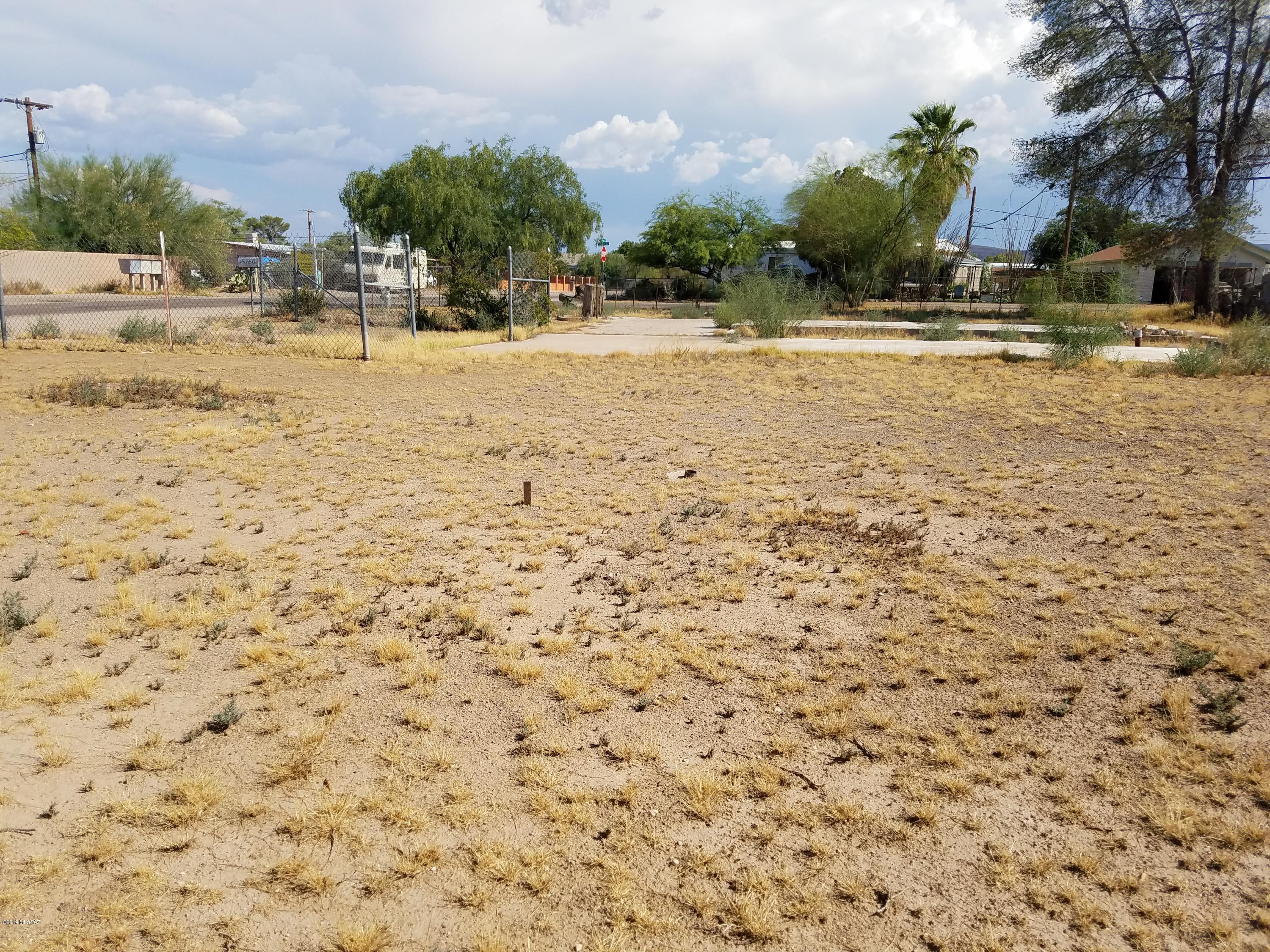 Premium Corner Lot in Drexel Heights! Utilities available at lot line. Close to lots of shopping and Manzanita Park. 10 Minutes from I-19. Agent related to seller.