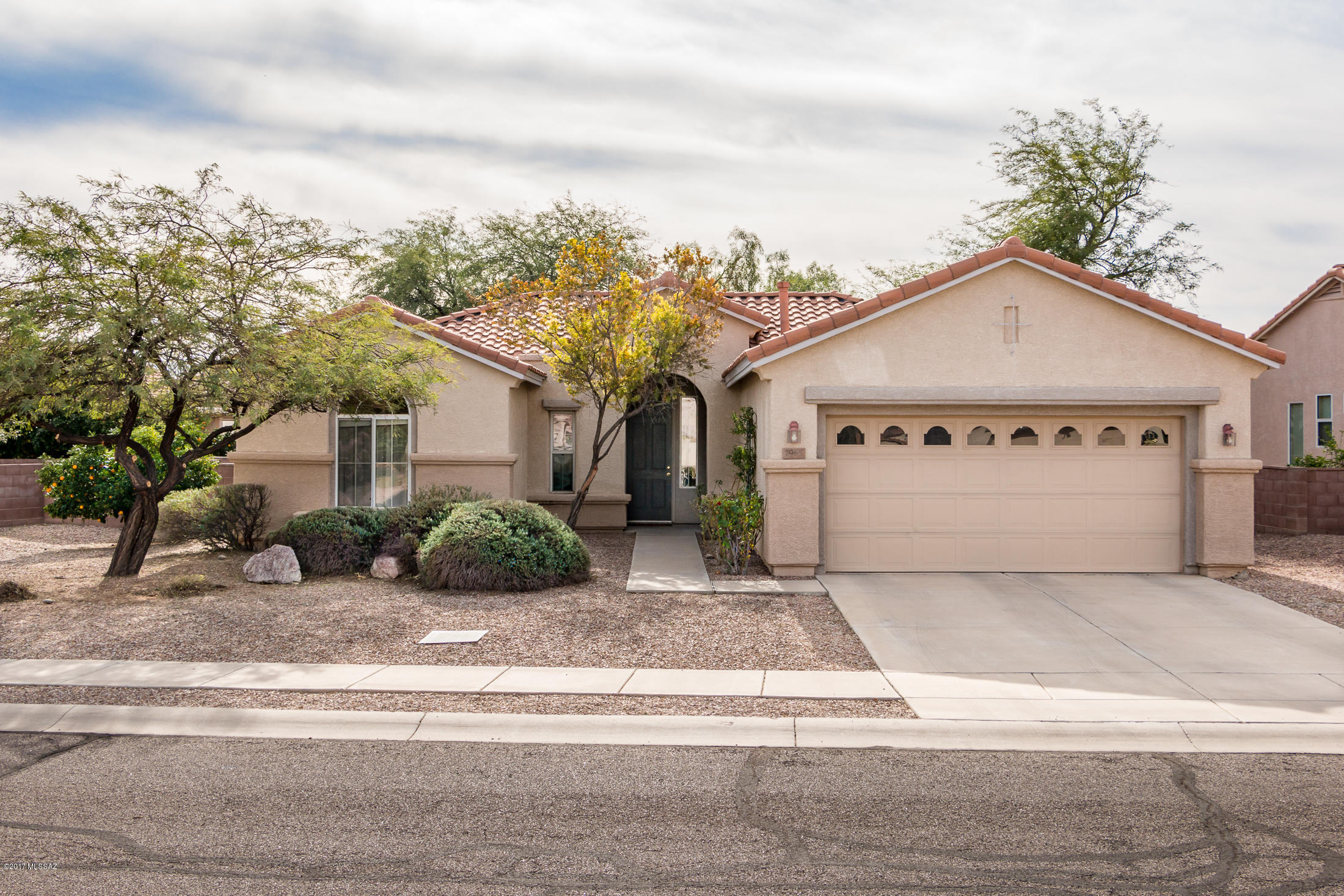 This lovely San Carlos model home is warm and inviting. The floor plan encompasses 2 bedrooms plus a den. As you enter, you will be greeted by the great room with an attached formal dining area. The kitchen boasts a bay window at the breakfast nook overlooking the fenced private backyard. The master suite, with bay window, provides a peaceful retreat. The master en-suite includes a walk-in shower. The guest bedroom is of good size and conveniently located next to the guest bath. The den is a great space and can easily be converted to another bedroom. The washer/dryer are located in a separate laundry room. The extended garage has a work bench providing ample space to work on projects. Easy care with tile throughout home. All appliances convey. Walking distance to Village Center.