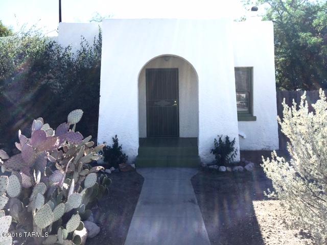 Have you been dreaming of an affordable, updated home in Feldmans, ideally located within walking distance to UMC, downtown, 4th Ave, and U of A.  Historic Bungalow has abundance of natural light, showcasing its classic original features including wood burning fireplace, original wood floors and windows. Important updates have been done. Wood floors have been professionally refinshed, fresh paint, recoated roof  and  A/C. with updated electrical.  Master bedroom has new cork flooring and wood beam ceilings. Bathroom has been beautifully retiled.  Large outdoor space with room for gardens and much more ready for your personal touch.  Ask about Historic Tax breaks available.