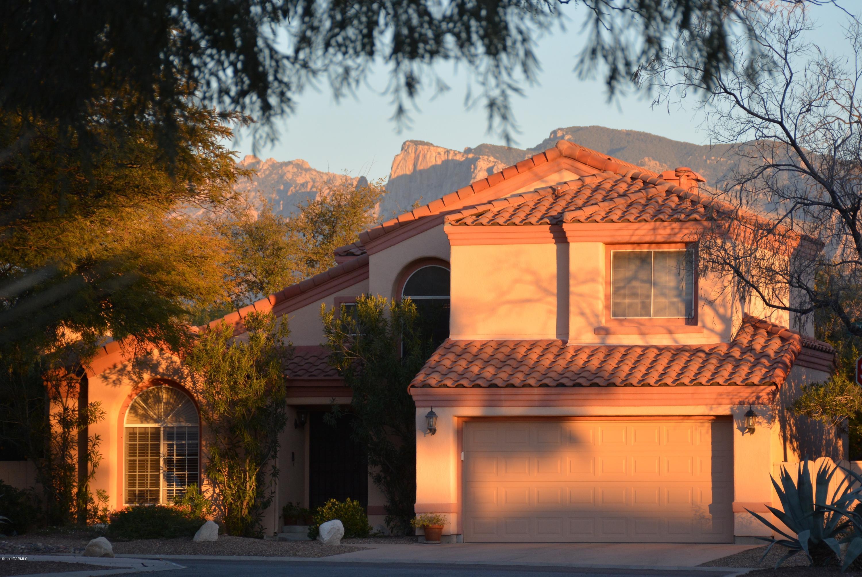 Located in desirable North Ranch this immaculate home  with 2,060 square feet includes 3 bedrooms, 2 full bathrooms, powder room, kitchen with breakfast nook, dining room, living room and a finished 2 car garage. Nearly every surface in the home has been updated.  Features Include: Granite slab counters, stainless steel appliances,  newer light fixtures, tile, carpet and wood laminate floors, fireplace, designer paint, and central vac.  Enjoy the best of Arizona outdoor living in the shade of towering mesquite trees, mature landscaping, over sized yard, built in BBQ, landscape lighting and trellised patios.  Only one block from the community pool, tennis courts, and playground.  It is more than a house, it’s a lifestyle.