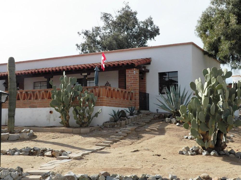 Fully furnished 2BR end unit villa set back from the street, on the circle, bordering desert common area and overlooking one of the community pools. Strategic elevated location-offering privacy and mountain views. Gated east-facing front patio. Desert paint tones compliment 16 tile and newly installed carpet in both bedrooms. Stacked W/D in rear storage shed. Clean, freshly painted kitchen. Currently not a member of Green Valley Recreation.
 
 Currently rented through 1st week in April at $1400/mo. Lease must be honored. Tenants would like to rent again Jan 2018  early April 2018.