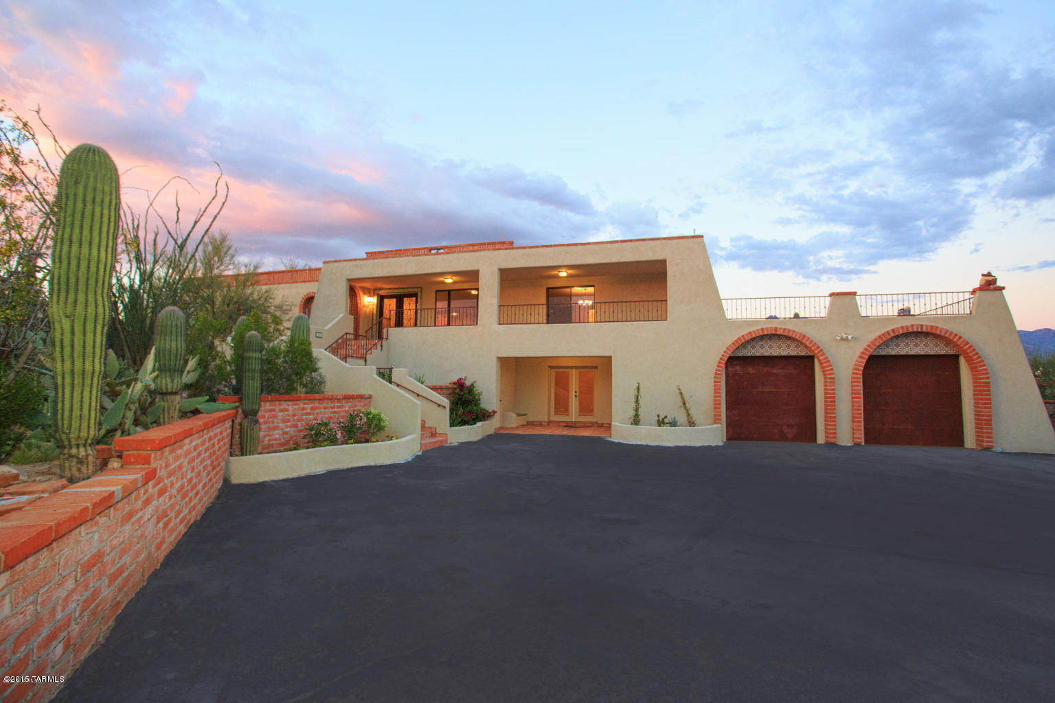Drastic Price Reduction! STUNNING Masonry Stucco Foothills Home completely remodeled and offering amazing city, mountain and sunset views! This home truly has it all! Fabulous updated gourmet island kitchen with beautiful custom cabinets, granite counter tops and high end stainless steel appliances. Extensive use of gorgeous Brazilian hardwood flooring. Updated luxurious bathrooms. Family room with cozy stacked stone fireplace and wet bar. Spacious living room with hardwood floors. Lower level 833 SF guest quarters w/ kitchenette, bedroom and updated bathroom. Enjoy the great outdoors with the private rear yard, terraced gardens, wrap around patios, spacious roof deck all offering stunning views! Car lover's dream with the over sized garage with enough room for 3-4 cars. Incredible value