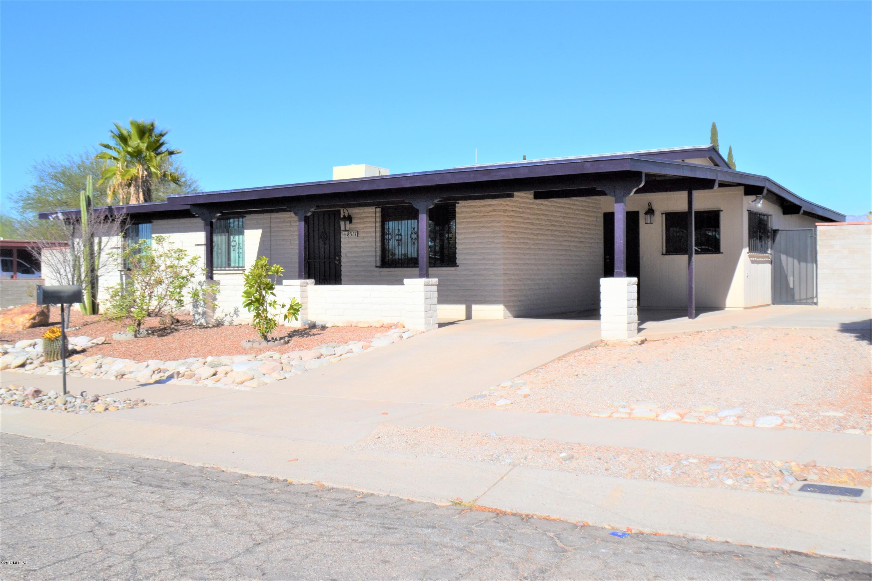 Beautiful Rolling Hills Golf area  territorial minutes from DMAFB, Raytheon, Pantano Bike path, shopping centers, restaurants, schools, and Rolling Hills golf course! This home has it all w/4 bedrooms, spacious living spaces, upgraded kitchen complete w/Bosch & Samsung appliances & Labrador Antique Granite countertops! The living area features soaring ceilings & a rustic wood burning fireplace that can be enjoyed from multiple rooms. Outdoor entertaining is easy w/a large covered patio overlooking lush citrus trees & pebble tech pool, 4 separately fenced yard areas & a workshop. Updated AC unit, roof & windows. NO HOA & room to park your RV or boat. This home is move in ready! Come live the good life... Another Diamond In The Desert!