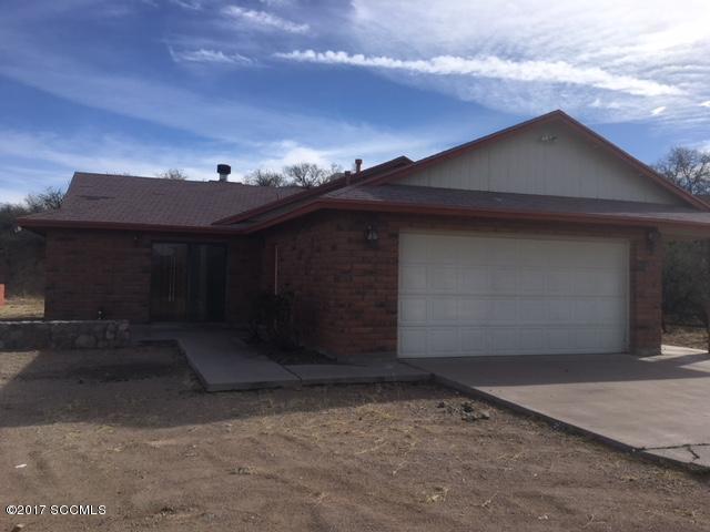 Great fixer upper on West side of Rio Rico.There is great potential for this beautiful hilltop lot property!! Just needs some TLC!