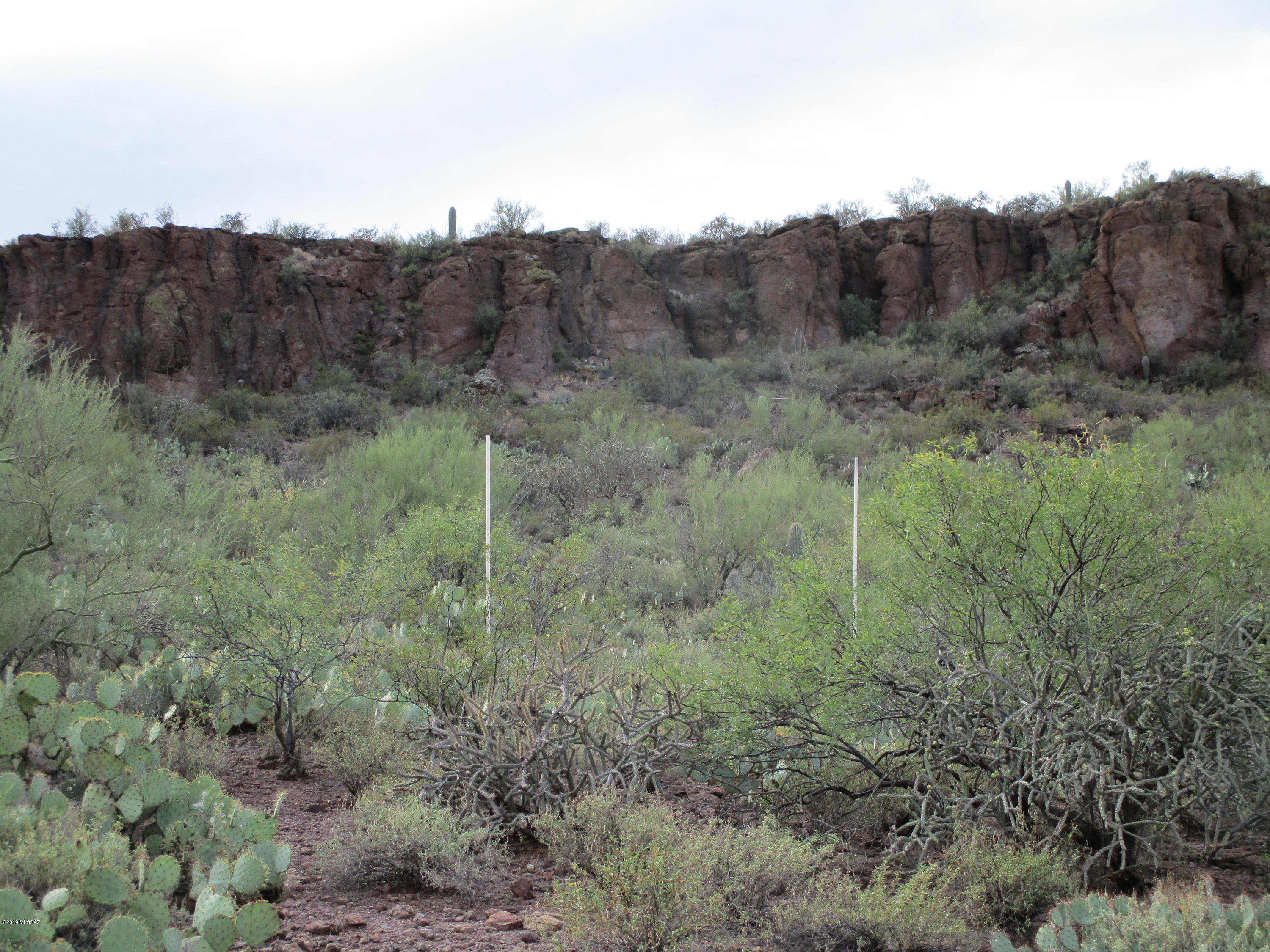 Incredible building site in the Tucson Mountains with great mountain and valley views. Many custom homes in the area. Close to Freeway and downtown. Water , Electric and Phone to lot line. Septic system will be required.