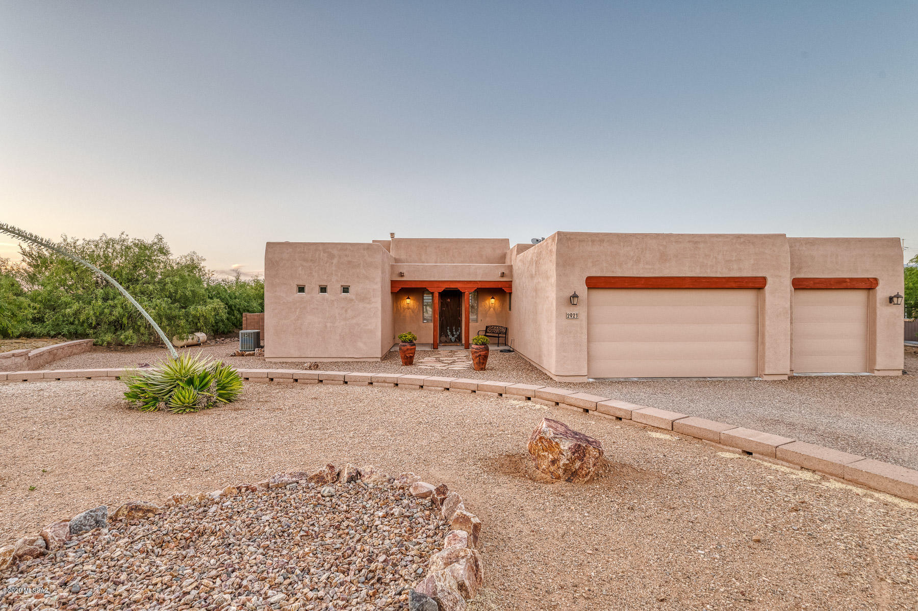 Luxury meets solitude in this modern, spacious 4 bed/3 bath on 1.73 acres in Vail School District. Entertain the family and guests in the beautiful, fully landscaped, tiered backyard, featuring a large pool and spa, covered patio, palm trees, firepit, playset, and sweeping mountain views. Come inside to a sleek kitchen featuring granite countertops, stainless steel appliances, island with prep sink, breakfast bar, and large dining area. Relax in your Master Retreat, featuring a walk-in closet, double vanity, garden tub, and separate patio entrance. The 3 car garage has room for all of your tools, storage, and toys. The smooth, crushed-gravel loop driveway with natural desert offers curb appeal, with RV and additional parking to the side.