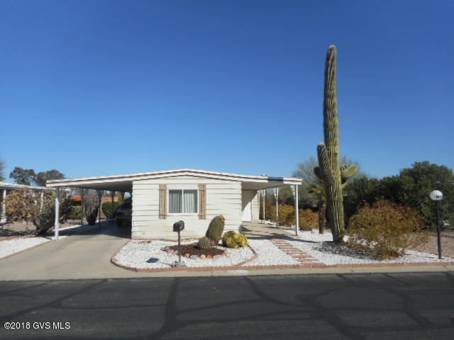 WOW, Don't miss out on this well maintained home with east mountain views. Interior done over, making it light and bright. Great Room with glass slider opens on to the finished Arizona Room and measures at approx. 168 sq. feet, (not included in square footage). A/C and gas furnace have been replaced along with floor covering. Kitchen area has lots of cabinets, 2 pantry's and a glass slider opening on to a covered patio for your sitting pleasure to enjoy the sunrises and sunsets. HOA fee is $55.00 month, includes clubhouse, spa, library, meeting room, exercise room, pool tables, horseshoe courts, shuffle board, ceramics, crafts, card games, bingo, weekly trash pick up and road maintenance. Great location, close to restaurants, churches, golf courses and medial facilities.