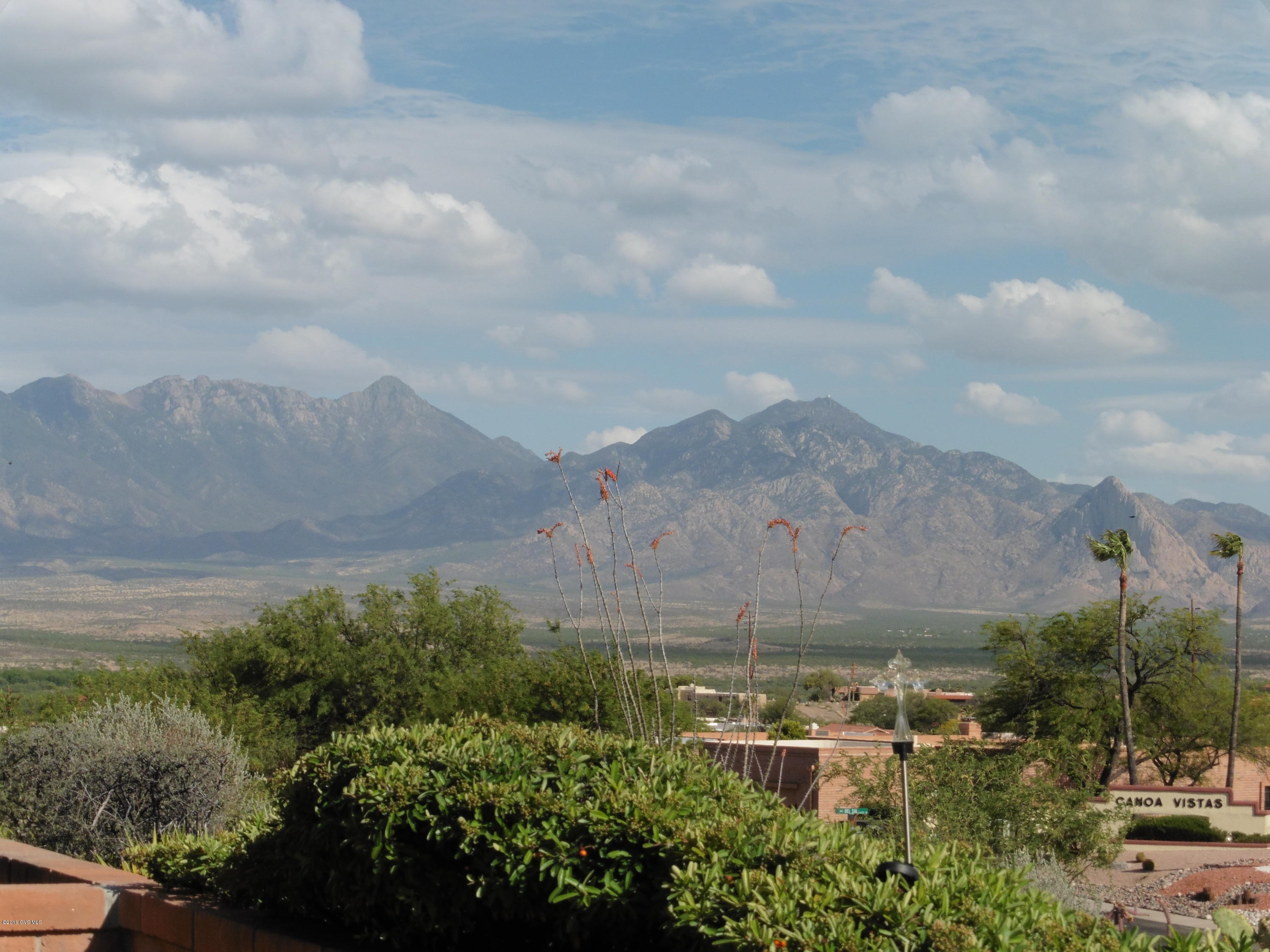 Now, this is a view! Enjoy sunrises, sunsets, star gazing and the every changing colors of the Santa Ritas, Elephant Head, Tumacocori, Little Colorado and Red Boy. Amazing updates throughout this house make it a true show stopper. Enjoy the elegant kitchen featuring a custom back-splash, unique light fixture and cabinets with glass inserts. Master suite includes access to the covered patio and walk-in closet. Short trail to the rec center. Additional features include: newer water heater, several skylights, and storage. Refrigerator, master bed valance and fireplace do not convey.