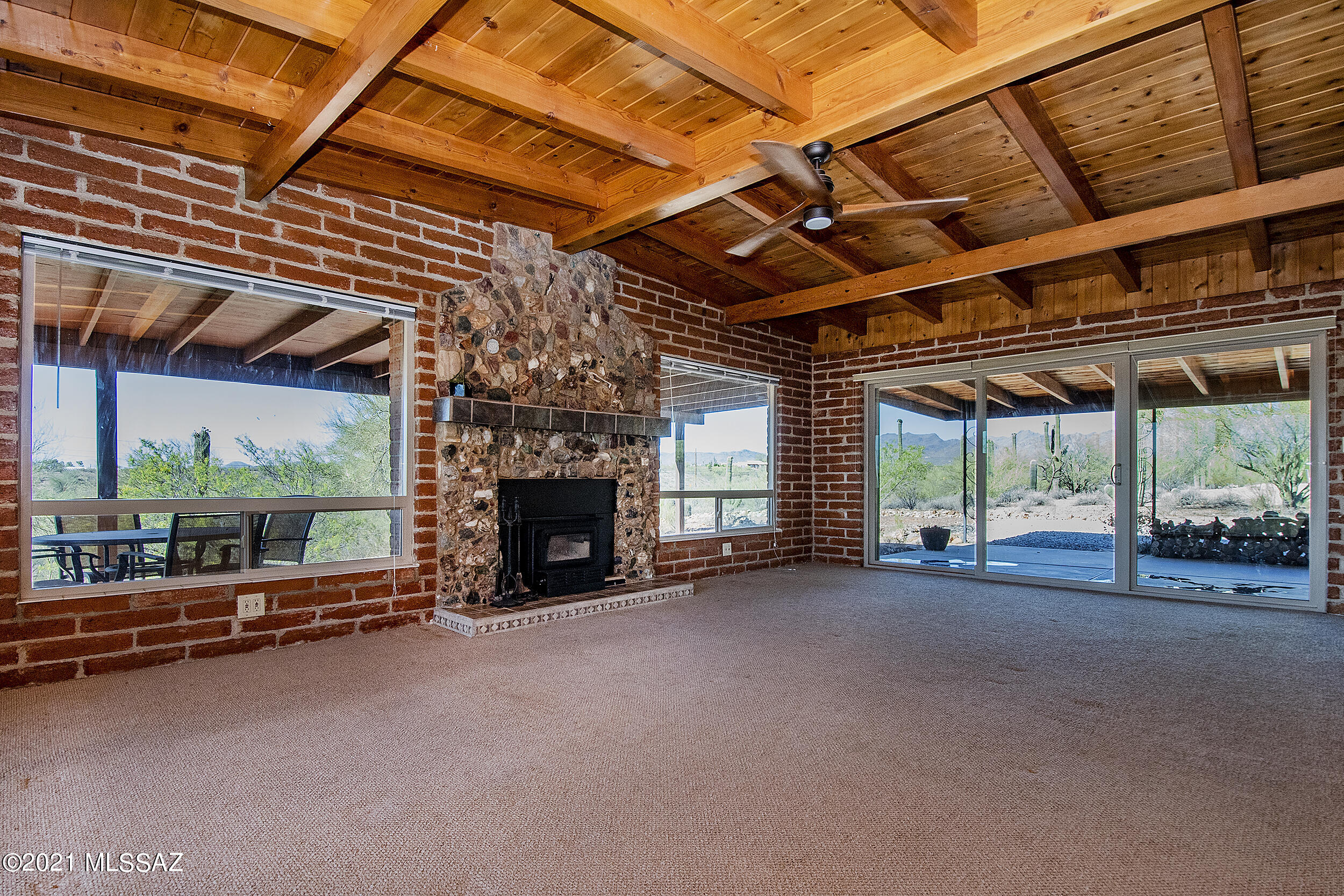 Stunning Mountain and City Views from this Unique 2 Bed/ 2 Bath Home on 3.3 Acres. Loaded with charm and ready to move into. The Living Room features Tongue and Groove Woodwork and Stone Fireplace with Wood Stove Insert. The kitchen features Stainless Steel Appliances and Original Wood Cabinets. Dual Pane Windows and Sliders throughout. Screened in Porch and a Covered Deck to soak in the Views. Very Private Location on the West Side, so convenient to I-10 and Downtown. All the work has been done for you. The seller has made the following improvements: replaced all septic/waste lines, replaced plumbing in the home, remodeled both bathrooms and laundry room, new washer/dryer, replaced electrical to bathrooms and laundry room, replaced the water heater. The Seller will extend the existing 2-10 Warranty to one year for the buyer.