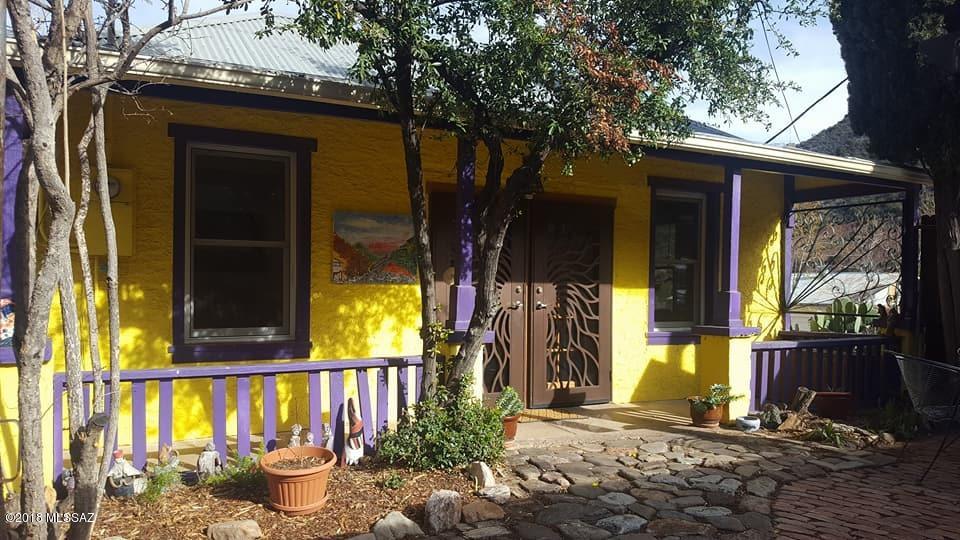 Turn-Key and move in ready!In the heart of Beautiful Old Bisbee w/incredible city & MTN views! This beauty has everything for an entertainers dream home or perfect vacation rental. The courtyard & wrap around patio's boast mature trees and privacy yet jaw dropping 360 views. Spacious home has 2 oversized bedrooms + formal dining room & grand living room. Master suite has a bidet and extra space for an office set up. The artfully designed metal screen doors offer privacy & security. The incredible art throughout the inside and outside of the home gives charm & elegance to the property. Most furniture can be inc. w/ the right offer, so the home is move-in ready inc  BBQ!https://youtu.be/rZ65h5CXTG8 Courtesy Perry Sjogren