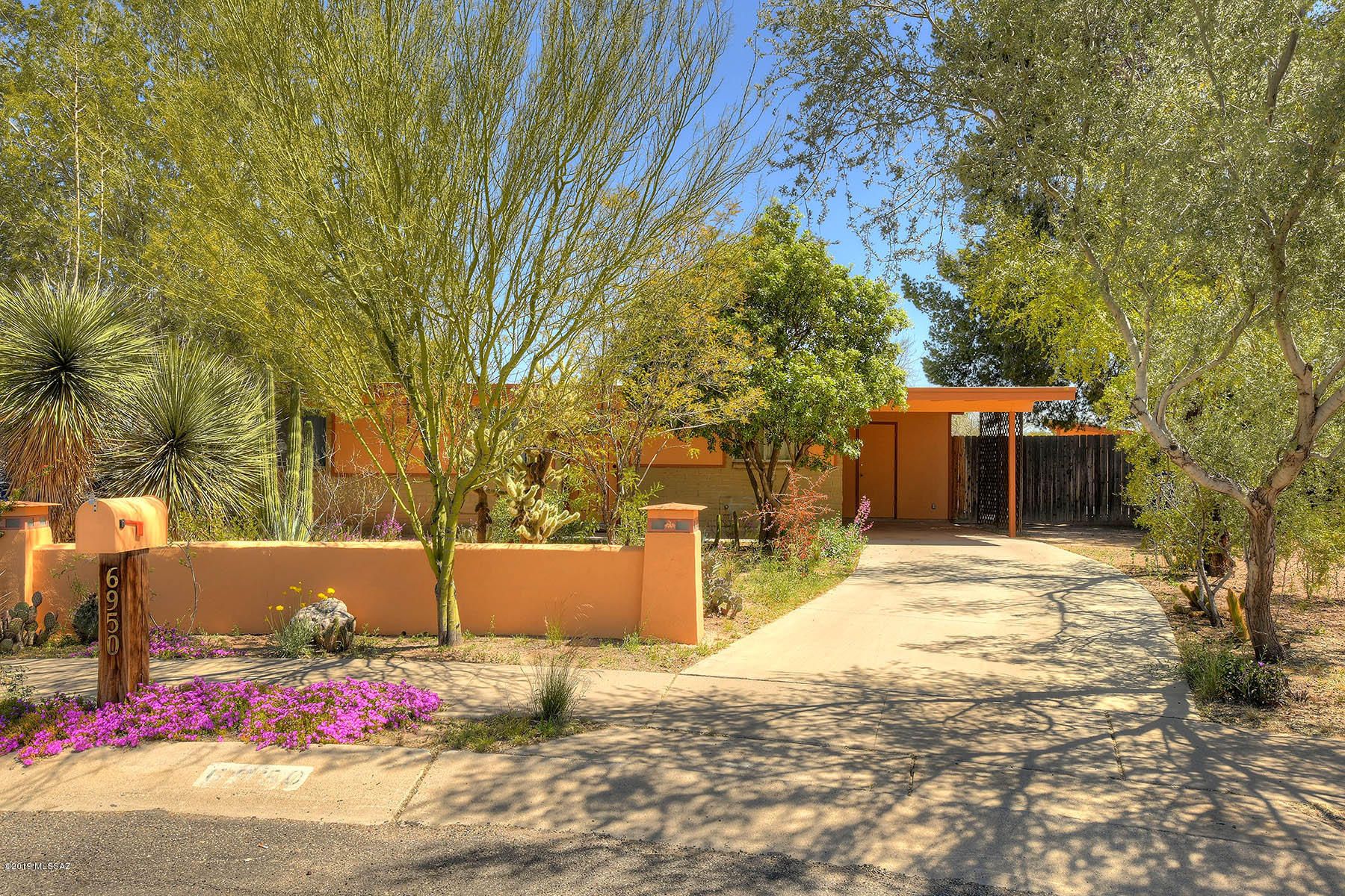 Gorgeous upgrades! Remodeled kitchen with solid hickory cabinets and granite slab countertops.  Newer dishwasher, faucet & LED lights. New neutral color ceramic tile floor throughout with new carpet in the bedrooms & living area. For your privacy, rolling shutters on most of the windows & nestled in a cul-de-sac. Fully enclosed backyard features soothing fountain, large brick patio & 8 ft block wall to the back w/vehicle & pedestrian gates. Mature landscaping with lots of shade & a producing tangerine tree. Large insulated shop/shed w/electric on concrete slab. Large master bedroom has adjoining 4th bedroom option with 2 additional bedrooms.  Interior & exterior freshly painted, on demand water heater & 400 amp electrical service. Near shopping, Davis Monthan, U of A, bus lines, & more.