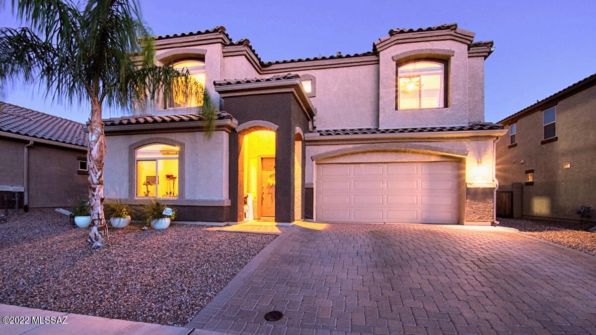 Everything is upgraded in this highly desirable Saguaro Bloom home! Enjoy swimming in your private sparkling PebbleTec pool, evenings gathered around the gas fire pit, shooting hoops in your backyard, an unwinding on your very own putting green. The backyard oasis boasts an extended covered patio to enjoy outdoor living at it's finest. You'll love the impeccable kitchen with SS appliances, granite countertops with an island for additional seating, 36'' glazed cabinets w/ crown molding, and a walk-in pantry. The downstairs offers a guest room (or office), with spacious living and dining and beautiful ceramic tile flooring throughout. Travel upstairs to a huge loft-like bonus room with 3 bedrooms, plus a gorgeous primary suite. Come see this one-of-a-kind beauty!