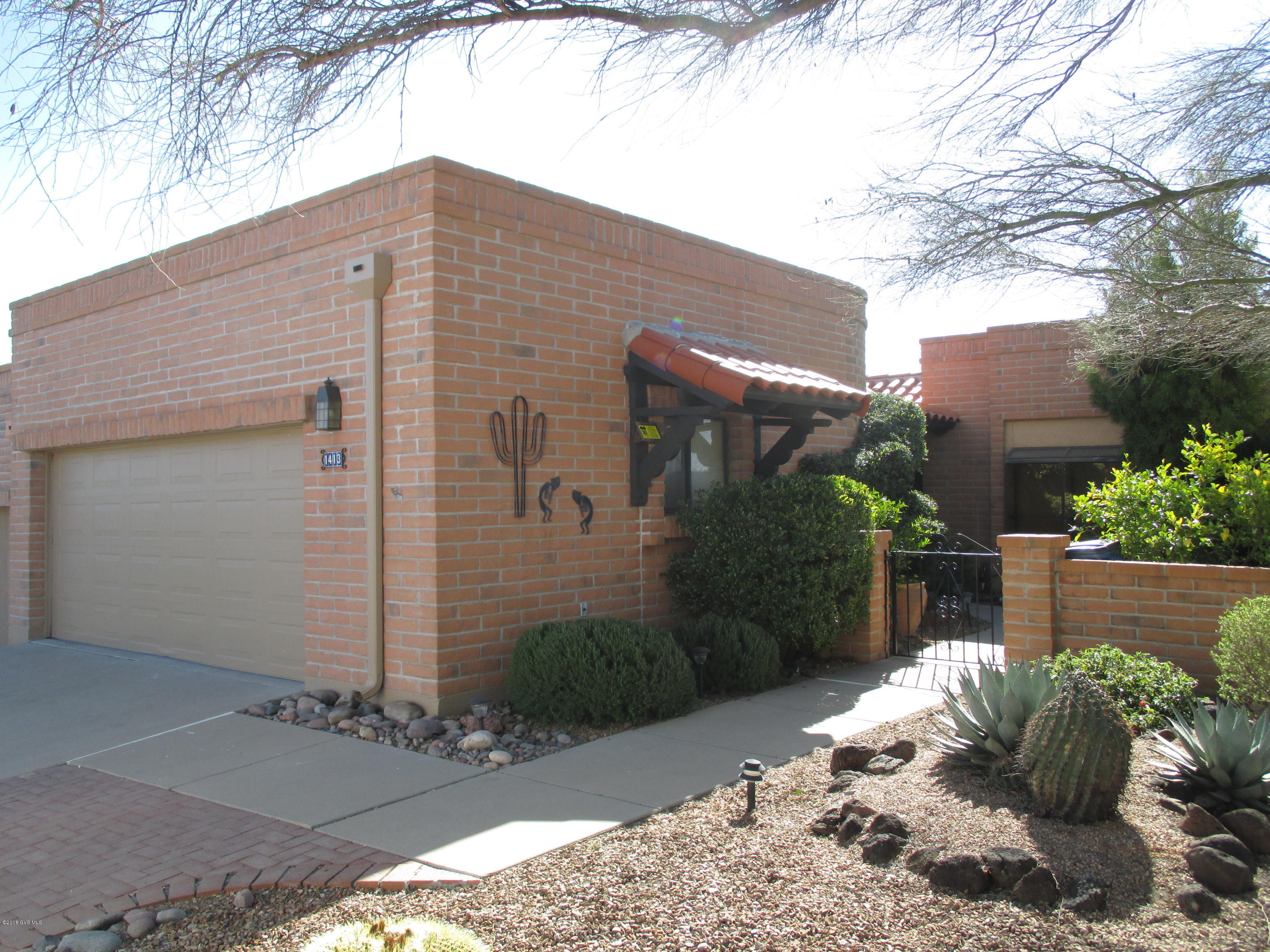 Views, views & more views! Wonderful 2 BD, 2 BA, end unit TH w/office and 2 car-garage. This home will invite you in through a Saltillo tiled screened front entry. Roomy kitchen w/desk area. Great room has gas log fireplace and slider to patio so you can take in the mountain views. A Saltillo tiled office in master bedroom is an added bonus. The panoramic mountain views are some of the best in Green Valley. Enjoy the views from Tubac to Tucson. No homes behind. Relax and entertain in the backyard w/fountain & natural gas grill. Freshly painted inside, outside trim & wrought iron painted, new bath light fixtures, new kitchen faucet, new water heater, garage & floor painted (2018). Roof recoated w/warranty (2018). Bryant GasPac installed 2014 w/warranty. You won't be disappointed!