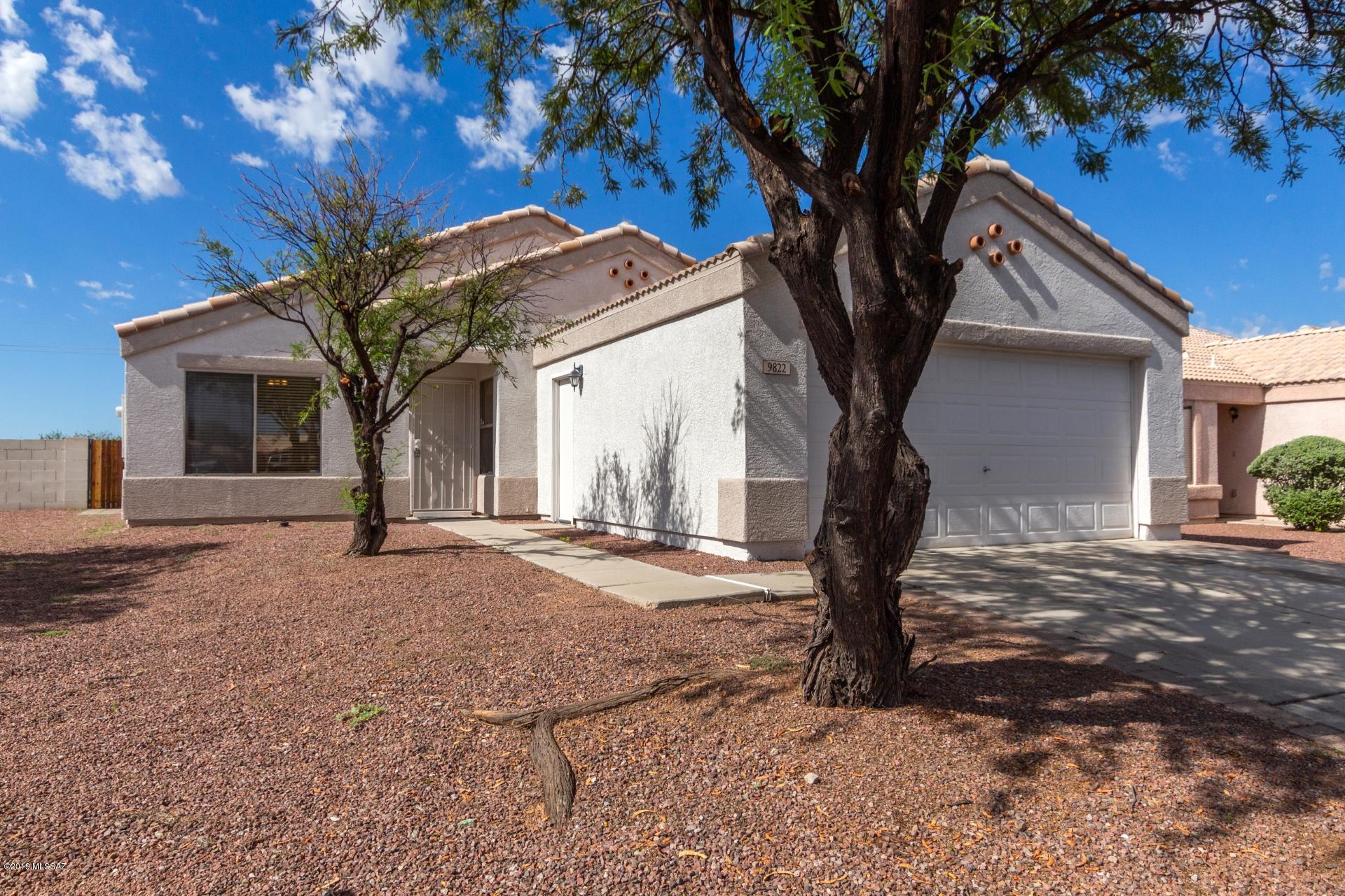 Charming single-story 2 bedrooms, 2 baths plus den home located in the highly sought after Rita Ranch neighborhood in Tucson. Freshly painted interior and exterior! Be delighted by sweeping tile/wood-look flooring throughout the home, no carpet! Enjoy front den/office space, spacious bedrooms, large living areas, and ceiling fans. Open kitchen boasts eye-catching tile backsplash, pantry, SS appliances. Peaceful master includes private ensuite. Ample backyard features covered patio, and lots of space for a pool or a blank slate to create your own. No neighbors to the rear! Close to schools, shopping and park. This one won't last long, come take a look!
