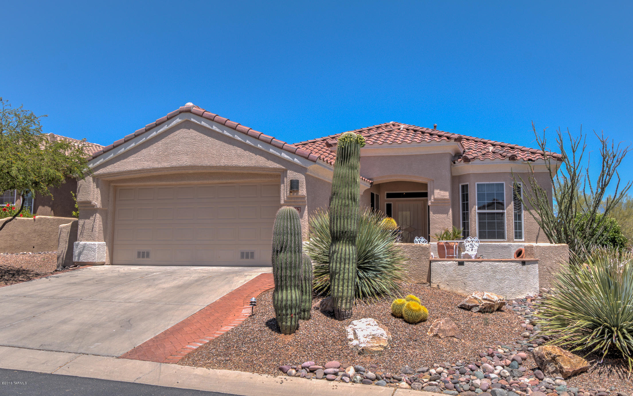 PRICE REDUCED. Extended CARSON/Hillsboro Floor plan ideally located on an East Facing lot with terrific VIEWS of the Catalina Mountains and golf course. 2Br/2Ba + Den w/1810 sq ft. Spacious open floor plan with entertainer's kitchen with Great Counter Top Space, Extended Oak Cabinetry and ALL SS APPLIANCES INCLUDED. Large master bedroom suite with walk-in closet and master bath with double vanities and walk-in shower. Spacious family room with gas fireplace and media built-ins. Spacious DEN, Guest Bedroom w/Bay Window and Guest Bath. Laundry Room w/Storage Cabinets. Large covered patio with extended brick paver seating areas. Excellent location on the 3rd Front Tee Box with Desert Buffer. You will know you have arrived. Call today for a personal showing.