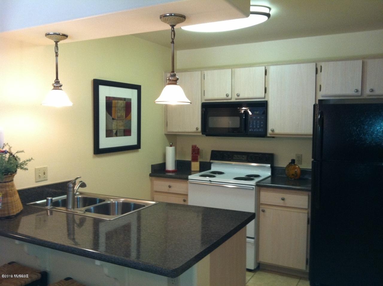 Premium pool side location at one of the most desirable condo communities in Tucson. Veranda at Ventana is a 24 hour gated access community located in the prestigious Ventana Canyon area surrounded by close up choice mountain views. This one bedroom/one bathroom unit will not last long! Upon entering the unit, you have a defined entry space with a partition wall looking in to a spacious great room. Kitchen features plenty of cabinet space, a breakfast bar and a walk in pantry. Owner's suite includes large walk in closet. Between the bathroom and the owner's suite, you will find a large double door linen closet providing more than ample storage space. Spacious private patio, close to shopping, dining, golf, hiking +++!