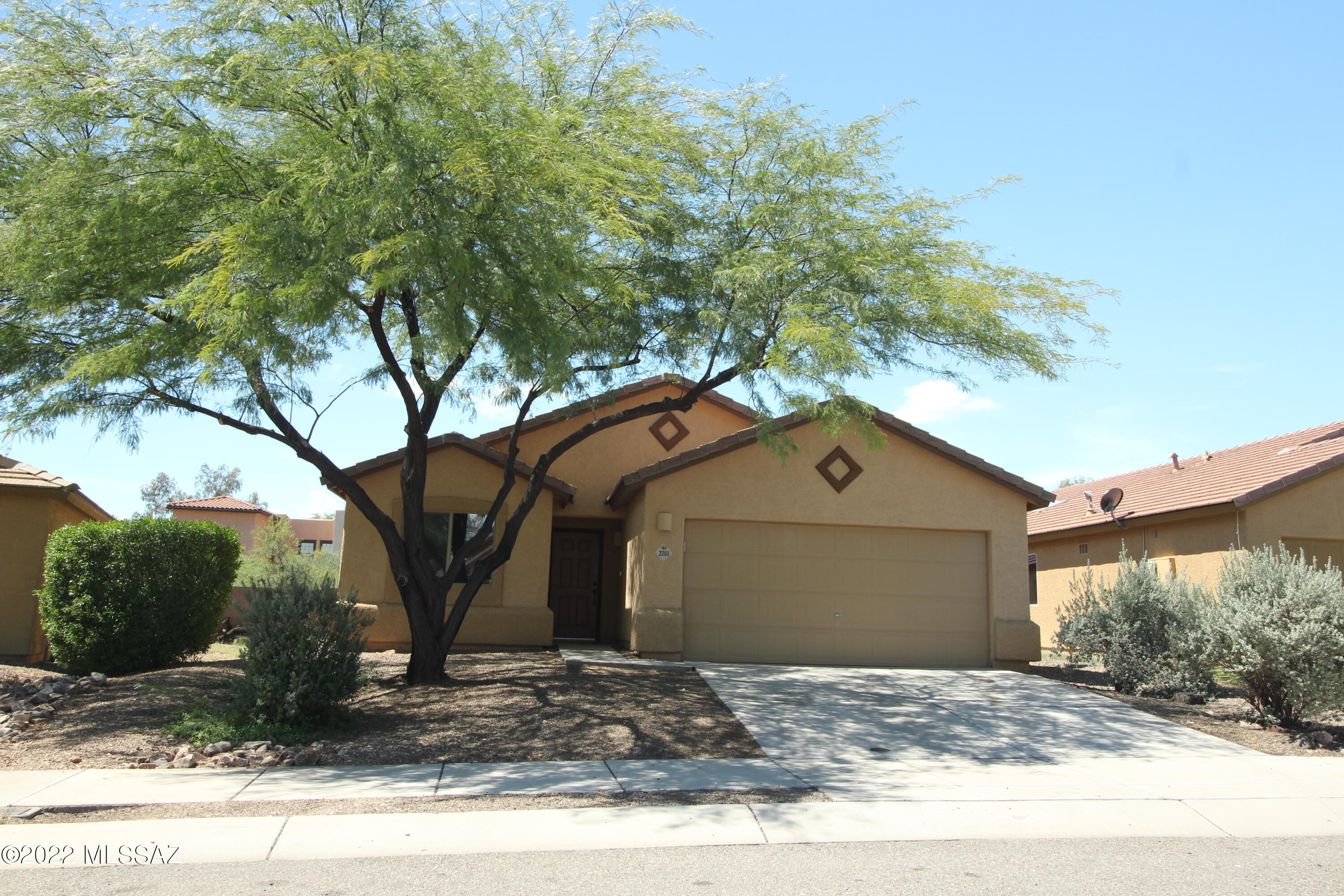 The best of both worlds! Peaceful neighborhood and the convenience of nearby amenities! That is what this home has to offer. Nestled in a small neighborhood among the Tucson Mountain foothills, you will be able to enjoy the quiet serenity of nearby hiking trails and yet you are just minutes from Downtown, Pima College and I-10. The vaulted ceilings and open floor plan add to the appeal of this home. Skylights and large windows allow for lots of natural light that welcomes you in. The Kitchen has plenty of cabinets and the granite counter island provides an additional eating/ entertaining space. The bedrooms are nicely sized and each has a ceiling fan. The 2 car garage has an epoxy finish and keypad for your convenience. Don't miss this one. Your search may be over!