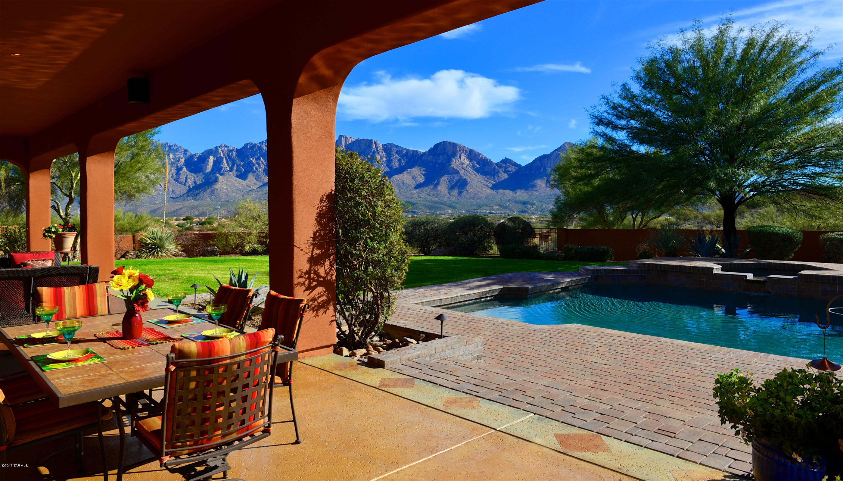 Captivating Catalina Mtn VIEWS! Impressive 4,804 SF contemporary on elevated 3.38 Acre cul-de-sac site in Coyote Ridge community in Oro Valley.  Entertainment/family-oriented 5BD/5BA split layout with Family Room, Wetbar, Rec Room, Wine Cellar & 4-Car Garage. Grand South-facing patio w/large enclosed yard, spacious patio, Salt-water Pool w/diving board, Spa, built-in BBQ and extensive hardscape & grass areas. Formal Living/Dining Rm w/3 sets of tall glass doors connects to covered patio w/multiple seating areas. Splendid Kitchen (granite, slate tile, Viking appls & gas cooktop w/prof hood) includes breakfast Nook with West-facing patio. Family Room offers charming Kiva Fpl, built-in desk, art shelves & Wetbar. Master with 2 custom closets & spacious updated bath w/steam shower. Perfection!