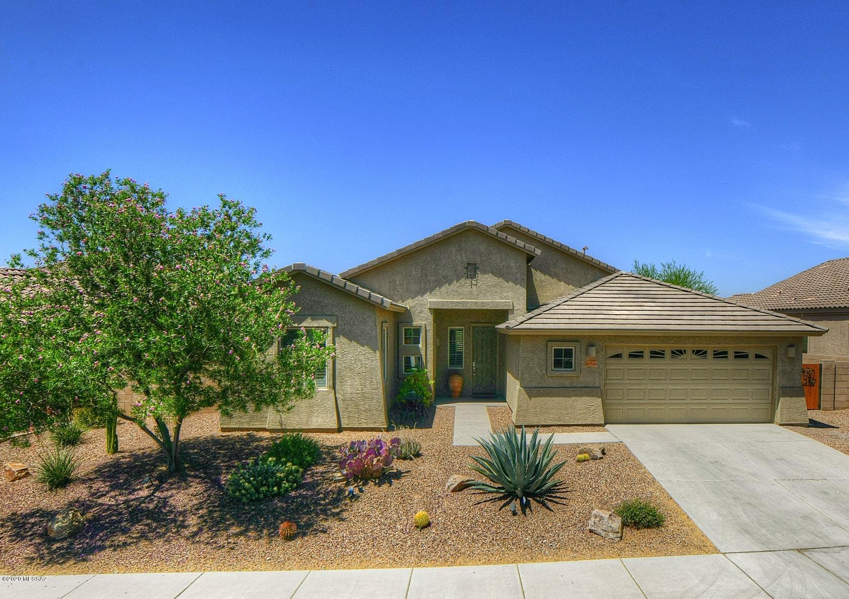Gorgeous Whitney model on premium lot in the gated Preserve at Dove Mountain boasts an open floor plan and panoramic mountain views. This 3BD/2BA (1,955 sq ft) home is loaded with extras including over-size ceramic tile in main living areas, wood shutters, keyless entry, extended width garage, new water softener and patio sunshades. Open concept Chef's kitchen boasts stainless appliances, granite counter-tops, island w/breakfast bar plus large dining nook. Spacious Master suite hosts his/hers walk-in closets, soaking tub and tiled walk-in shower. Laundry room features built-in cabinets and storage shelves. Enjoy an amazing sunset from the rear covered patio w/ceiling fans. Pool sized yard is easy care and backs to open space offering panoramic mountain/sunset views. See 3D virtual tour!