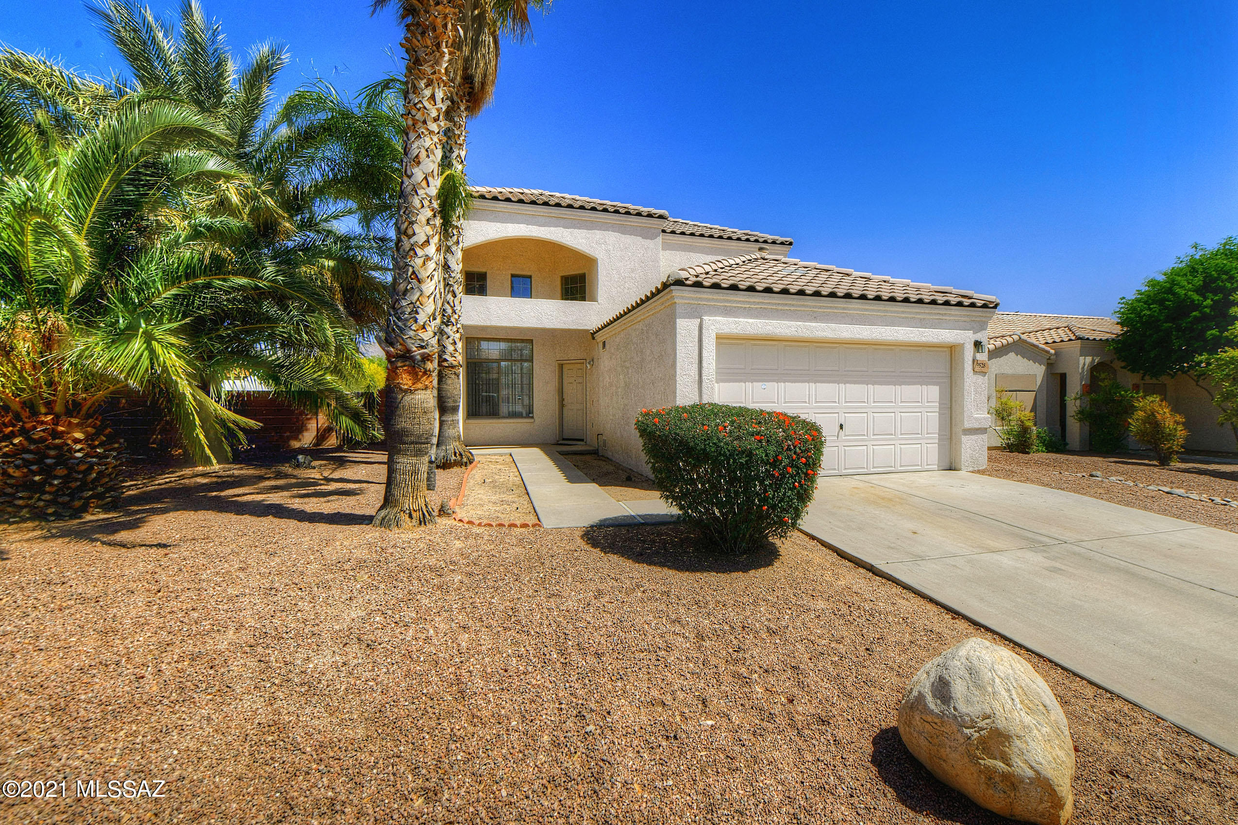 Move-in ready 4 bedroom/3 bath home with large yard and mountain views! This steel frame and block home  with stucco finish shows pride of ownership and boasts a beautifully updated kitchen with Granite slab counters, center island and stainless appliances which include a double oven, microwave, refrigerator and dishwasher. There is a family room off the kitchen plus a pantry and eat-in breakfast nook. The living space off the entry has a gas fireplace and is currently being used as a formal dining rm. Flexible floorplan has 1BR and 1BA downstairs. The Master suite  plus 2 BR's and 1 BA upstairs. Master suite  has a balcony & a gorgeous master bath remodel. Also, new window & door in Master suite.  Downstairs tile & grout just cleaned. New exterior paint. Oversized lot is a huge bonus! Ring doorbell system stays with the home.