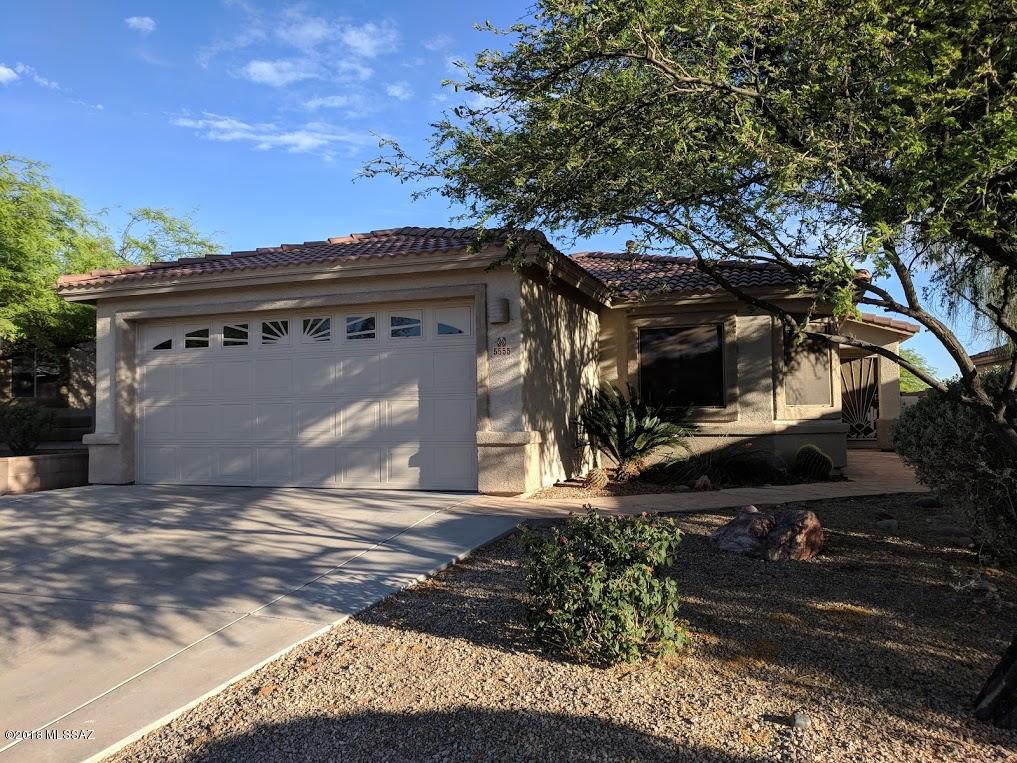 This Dove Mountain beauty features a split bedroom plan with 3-bedrooms plus a Den; and two full baths.  Master has garden tub with separate walk-in shower and two sinks. Kitchen includes tile counters and all appliances including washer, dryer and water softener.  Fans in all the rooms including the covered patio.  Now we get to the good stuff with a conventional pool and built-in spa with auto-closing, latching gates meeting Pima County Barrier Code Requirements.  Built-in charcoal grill and great views.  Fountain decor in the back conveys as-is.