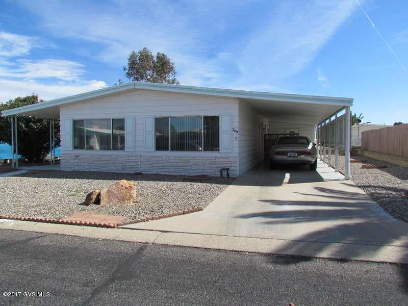 SPACIOUS 2 BEDROOM HOME. MOVE IN CONDITION. THIS HOME AS BEEN WELL MAINTAINED. LOTS OF OUTSIDE SPACES AND STORAGE, AZ ROOM, SEPARATE LARGE LAUNDRY/STORAGE ROOM, MT VIEWS FROM SCREENED BACK PATIO. LARGE LIVING ROOM WITH VAULTED CEILINGS. ADDITIONAL FAMILY/DINING ROOM. 4 CEILING FANS THROUGH OUT THE HOME. ROOF COATED IN SUMMER OF 2016. TERMITE WARRANTY WITH BILL'S HOME SERVICE.MAKE THIS YOUR FULL OR PART TIME HOME IN GREEN VALLEY.