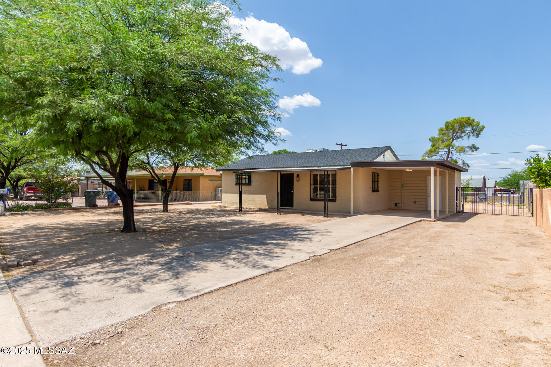 Move-in ready and full of character, this beautifully maintained single-story home offers comfort, convenience, and curb appeal. Recently updated with a brand new roof, New AC and New water heater. The property features mature shade trees and carport parking. Inside, you'll find a spacious living room with tall ceilings, neutral paint tones, and durable tile flooring throughout. The eat-in kitchen boasts rich wood cabinetry, a tile backsplash, and built-in appliances, creating a warm and functional cooking space. This home includes two well-sized bedrooms and a pristine bathroom with a designer-tile shower. while the large backyard is ideal for outdoor entertaining or simply enjoenjoying the outdoors. Owner/Agent