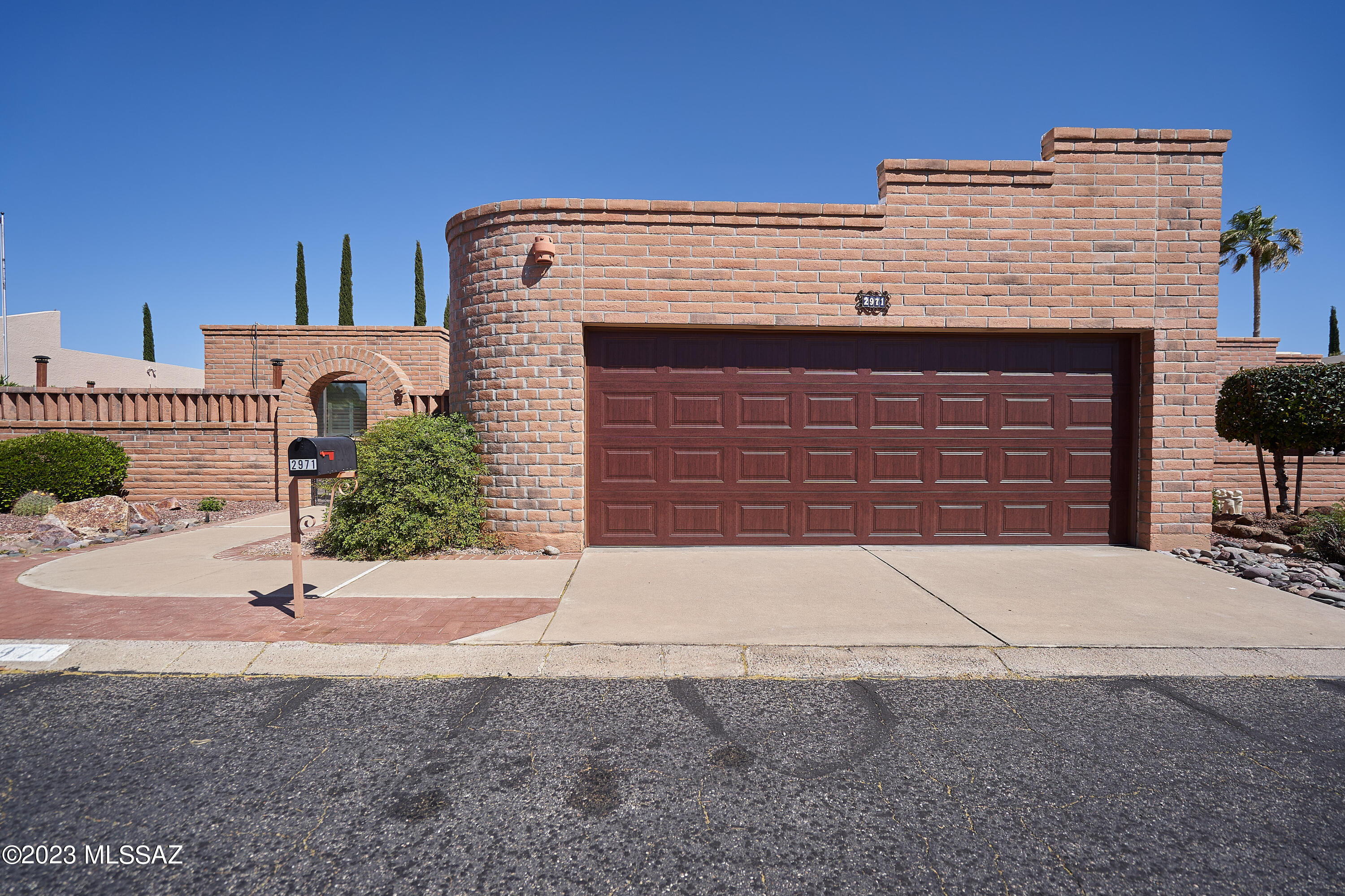 Beautiful home on cul de sac street in desirable Desert Hills 5. Large great room with fireplace opens to one of two covered patios, family/TV room off kitchen that opens to the second of the two covered patios, two large bedrooms, walk-in shower in main bath, walk-in closet in main bedroom is attached to spacious laundry room for easy access. Bright open kitchen with tile counters, slide out shelves and stainless appliances. Beautiful Saltillo tile flooring throughout traffic areas. Shutters on windows and patio doors. Enjoy back yard with mature fruit trees, small, raised garden area and mountain views.  Private walled yards both front and back. Back yard is adjacent to ally easement and sits high above rear homes. Oversized two car garage with attached cabinets, additional storage shelving and utility sink. Only 4 miles to GVR.