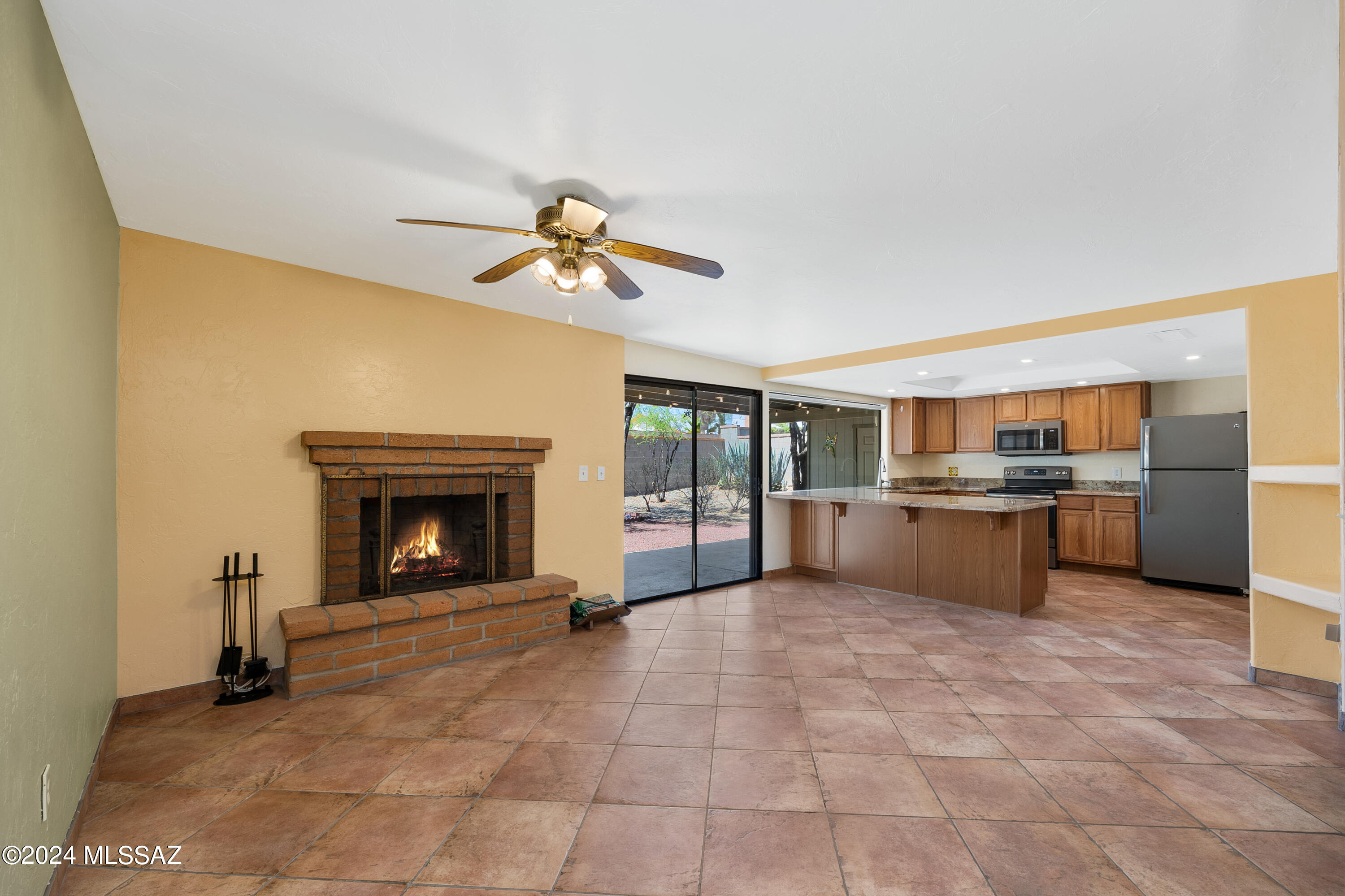 Wonderful 5 bedroom/2 bath 2037 square foot home in a quite eastside neighborhood that is move-in ready!  Built in 1970, no HOA and it comes with TEP owned solar that is fully transferrable, NO LOAN, it's utility owned with a fixed rate of $64.35 plus tax a month!  TOTAL!
It has newly refreshed bathrooms with new tile, waterfall showers, new toilets, custom cabinets and granite countertops.  The open, large Kitchen/Great Room offers granite countertops, granite sink, newer appliances and wood-burning fireplace.
In 2020 a 262 sq ft 5th bedroom/bonus room was added with a large closet, Lifeproof flooring and mini-split heat and cooling unit.  Other features are rolling shutters on sliding glass doors and all moving windows, for extra privacy and security, new paint in bedrooms and baths,