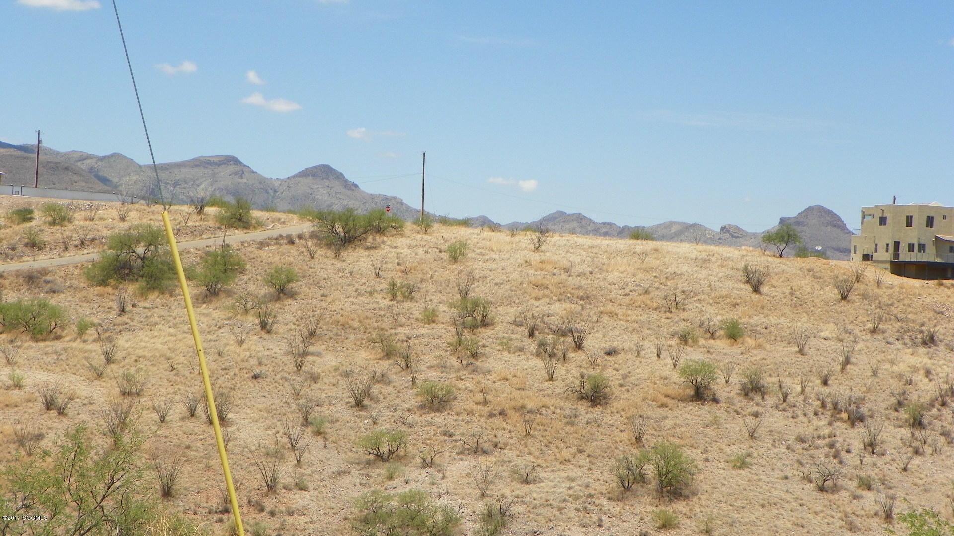 Residential lot, quiet area out away from people with dramatic views. Some of the roads are dirt. Gentle downhill slope, southern Exposure. Electric and water at the street.