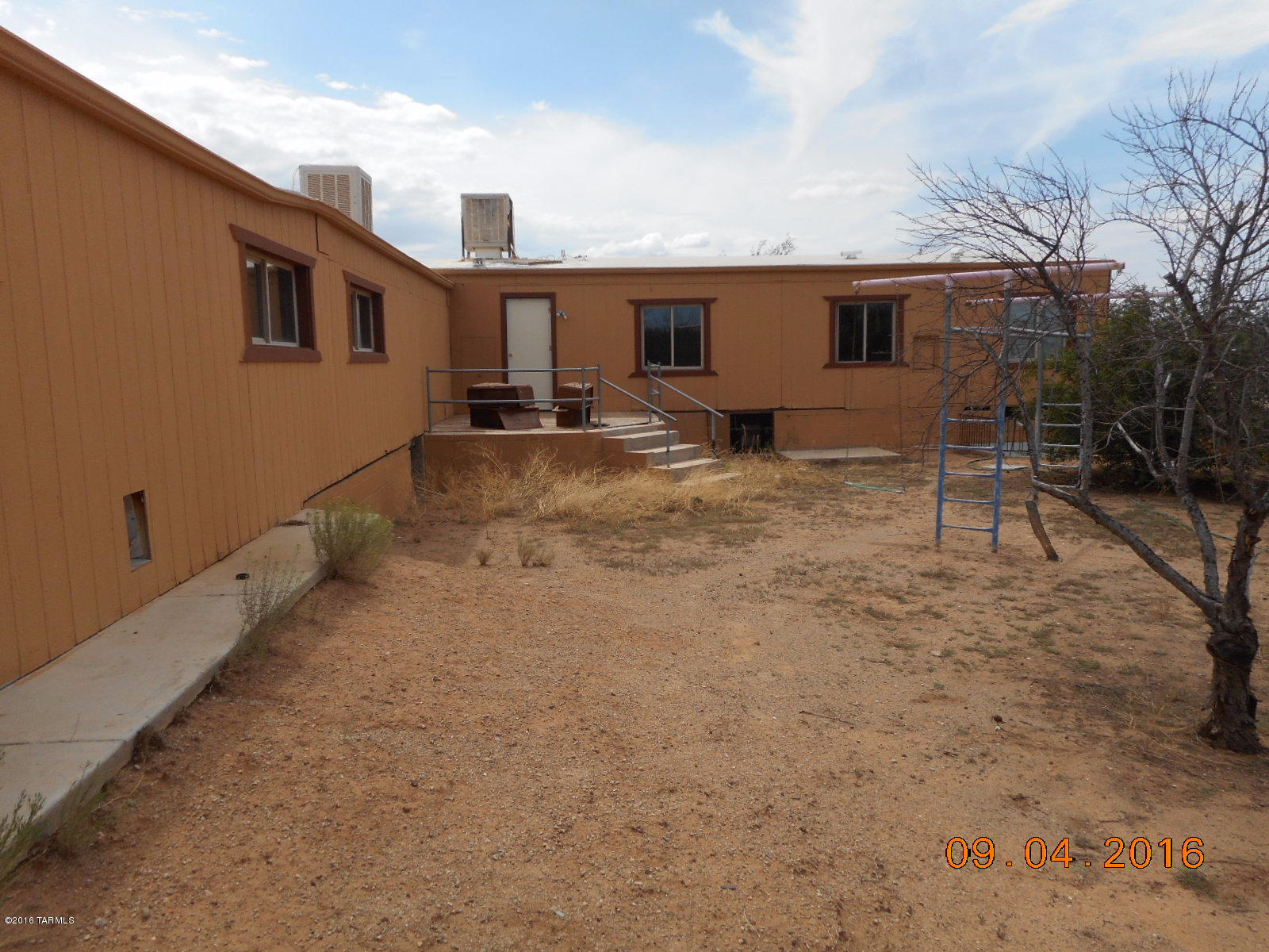 ROLL UP YOUR SLEEVES AND PUT SOME SWEAT EQUITY INTO THIS MANUFACTURED HOME AND ENJOY THE SERENITY OF THE DESERT.ENJOY THE FEEL OF BEING IN THE COUNTRY YET WITHIN A 20 MINUTES TO THE INTERSTATE. WORK HAD BEGUN ON THIS HOME AND IT NOW JUST NEEDS FINISHING TOUCHES. WITH 5 ACRES OF LAND TO SPREAD OUT ON, THE IDEAS AND CREATIVITY CAN BEGIN TO FLOW.  A UNIQUE SET UP WITH A DOUBLEWIDE AND ATTACHED SINGLE WIDE GIVE YOU A MAIN HOUSE AND A GUEST QUARTERS.  PROPERTY SOLD AS-IS. BUYER TO VERIFY ALL FACTS.