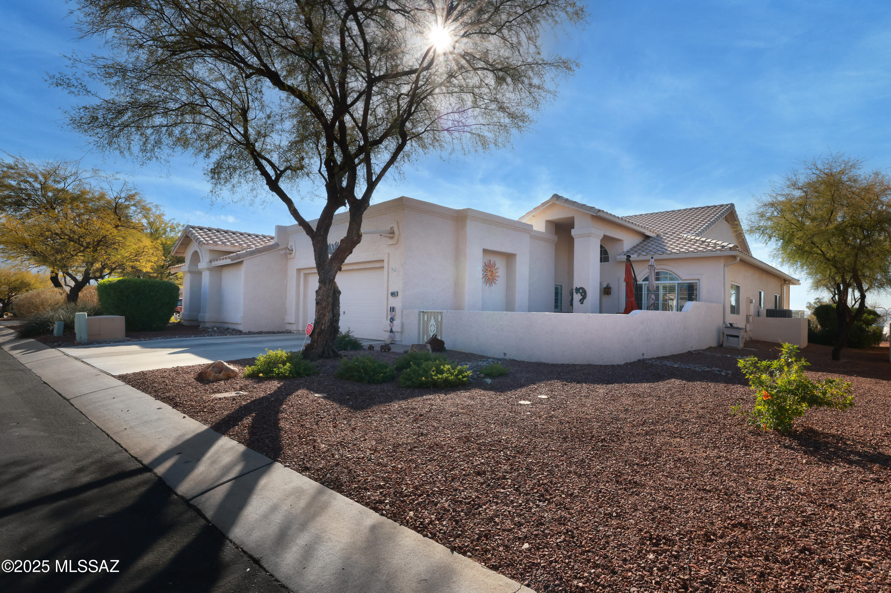 Charming townhome located in popular gated Oro Valley community of Carmel Pointe. Nicely upgraded unit is a spacious 3BR/2BA. Open & bright with lots of natural light. Great room, dining room, breakfast bar & nook all open make this a comfortable floorplan for living & entertaining. Roomy primary bedroom w/luxurious bath that includes a large shower & jetted tub. Covered patio features BBQ grill & overlooks tennis courts & OV Community Center which is in walking distance. Beautiful courtyard entry offers room for patio furniture & firepit. Generous guest bedroom & bath is split from primary bedroom. 3rd Bedroom currently used as office/den. Roomy kitchen with island, granite counters & lots of counter/cabinet space. Very desirable neighborhood convenient to restaurants, shopping & more
