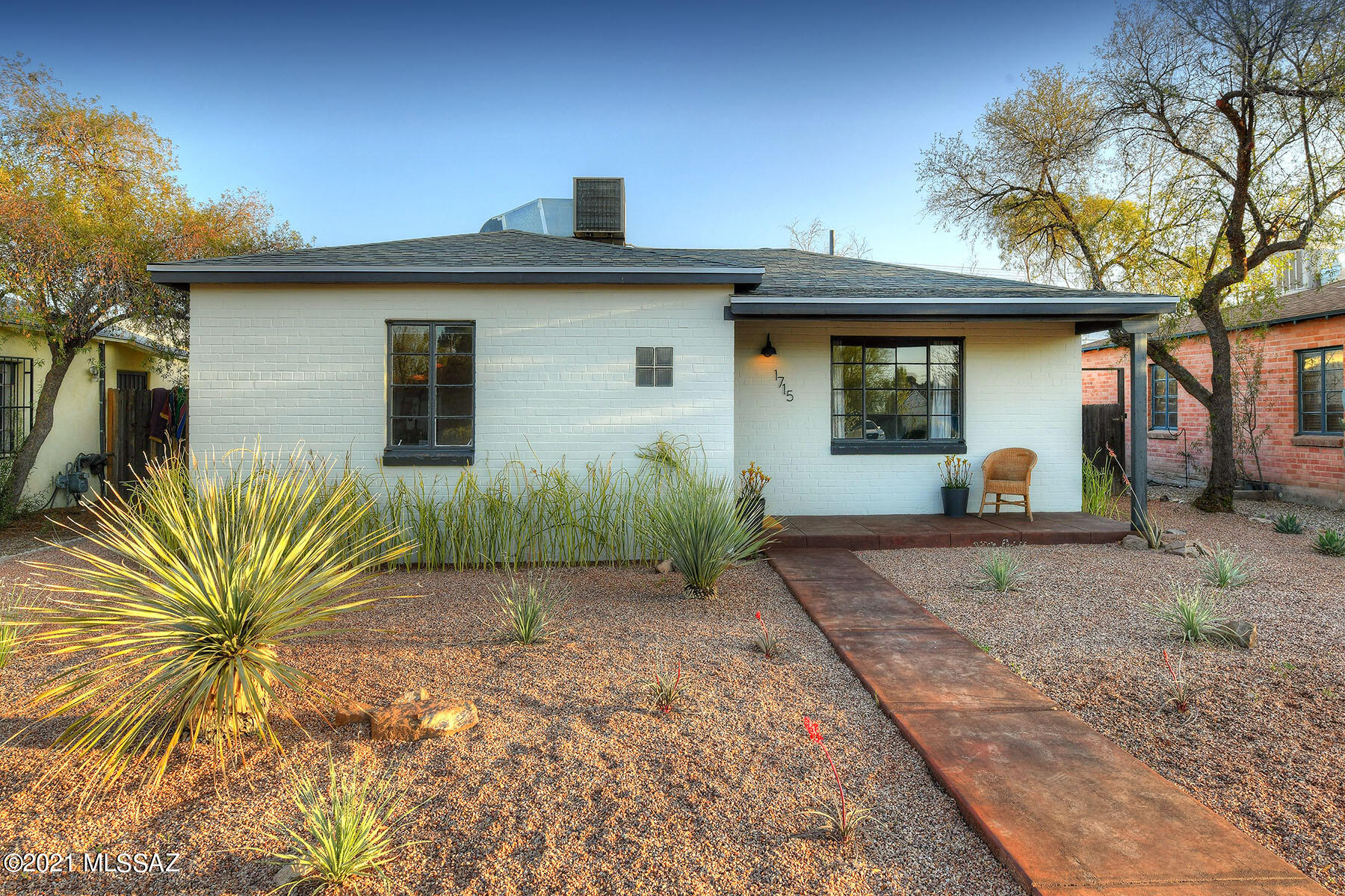Charming, updated double brick bungalow on a large lot just minutes away from U of A and Banner Medical Center. Property has new roof, updated bathroom and kitchen, quartz countertop, new stainless steel appliances, new carpet, tile floors, new light fixtures, new window coverings and more. Spacious Arizona Room looks out to large, fenced in backyard with opportunity to install pool, expand home, etc. Entire interior and exterior of home freshly painted, and front yard totally re-landscaped with desert plantings and decorative rock. Walking distance to many dining areas, shopping, etc. Carport accessed from back alley. Don't miss out on this opportunity to own and live in the Campbell corridor!