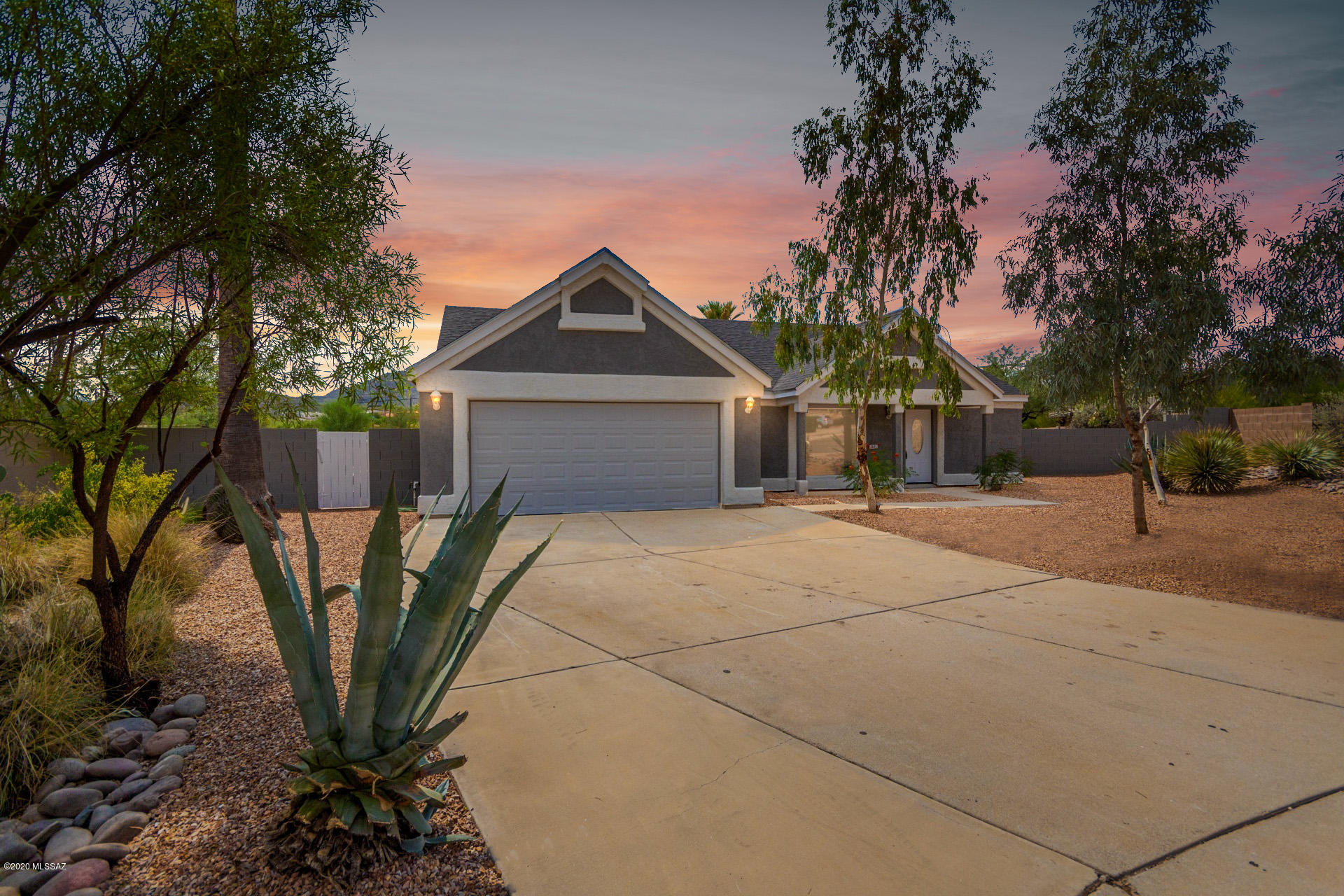 Stunning home with amazing upgrades available in Saddlewood Ranch. Excellent west side location, minutes to shopping and restaurants and within easy reach of the I-10, the UofA and downtown Tucson. Gorgeous inside and out this gem features great curb appeal leading into a spacious open floor plan with tasteful finishes throughout. Soaring vaulted ceilings, custom two tone paint, and wood look tile flooring in all of the right places. Remodeled kitchen boasts sleek stone countertops, ss appliances, white cabinets and a breakfast bar. Master retreat includes a walk in closet and highly updated en-suite with dual sinks and a shower with tile surround. You will love the outdoor space. Huge backyard offers an extended covered patio, mountain views and a sparkling pool and spa. Don't miss it.