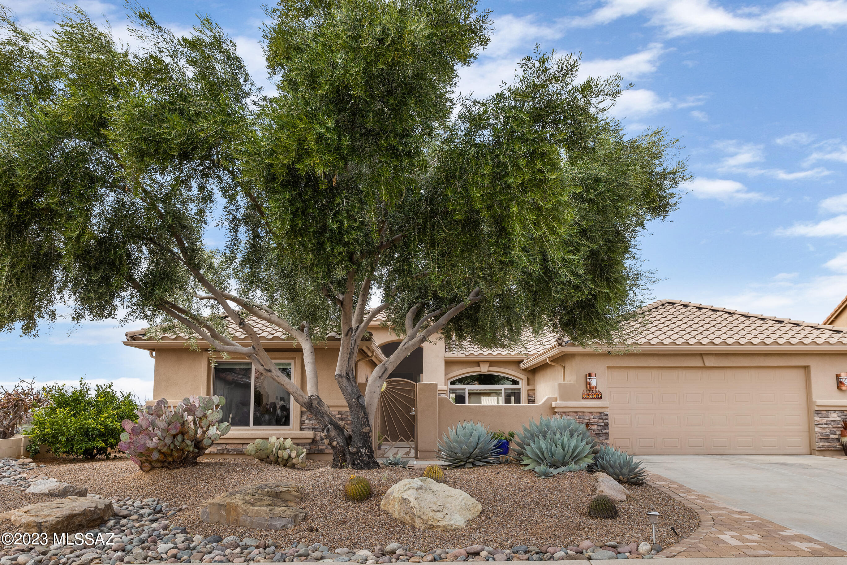 We're Proud to Present an Updated Laredo with Guest House & Mountain Views! This 3 Bedroom + Den / 3 Bathroom / 2,232 SF / Extended 2 Car Garage Home is just what you've been looking for! Great Curb Appeal & Private Courtyard. Large Tile & Mohawk Tigerwood Natural Hardwood flooring. Great Room with Gas Fireplace & Slider to Patio. Kitchen has Stainless Steel Appliances, Granite Countertops, Gas Range, & Nutmeg Cabinets. Owner's Suite with walk-in shower & custom organized walk-in closet. Guest Bedroom with closet & bathroom nearby. Laundry Room offers W/D, Desk, & Cabinets. Guest House has serving station with Sink & Bathroom with shower. 2 Car Garage. Covered Patio with extended paver patio, Fountain, & Chimenea Fireplace. Beautiful Landscaping, Fruit Trees, Gated Yard, & Mountain Views.