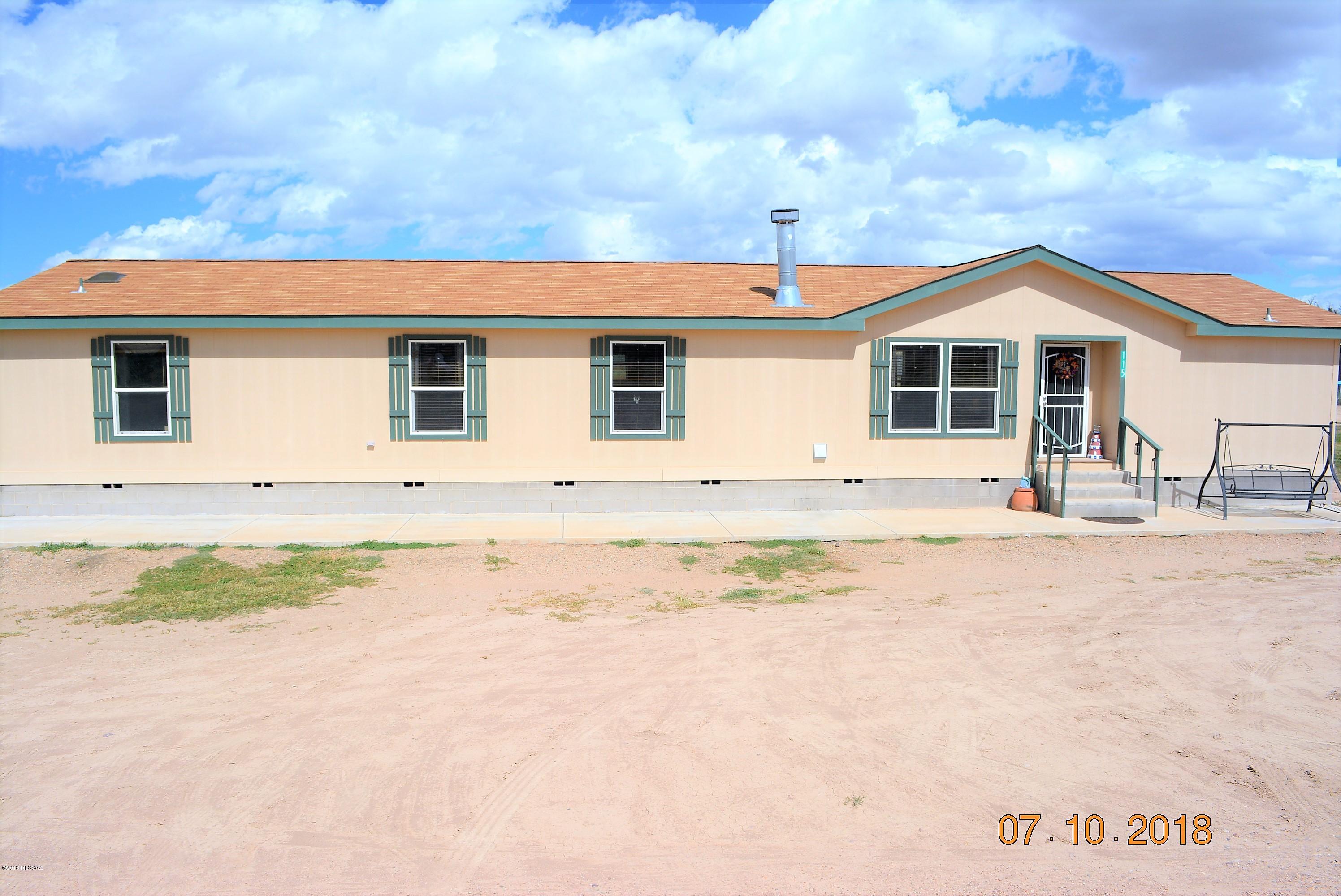 Located in a quiet neighborhood in St. David, this home is only minutes away from Benson and Tombstone and is conveniently close to schools. Home consists of 2 spacious living spaces, 4 bedrooms with walk-in closets, 2 baths, bonus den, and a spacious master suite. Wood burning fireplace located in living room provides warm cozy winters. Built-in entertainment center in 2nd living room. Kitchen features black appliances, knotty alder wood cabinetry with sliding drawers, breakfast bar, island, and beautiful countertops. Formal dining has sliding doors with built-in window blinds leading to large back patio. Home is built with 2x6 construction for maximum insulation to conserve energy, tape & texture throughout, and high speed internet availability. Home sits on 0.88 acre lot.