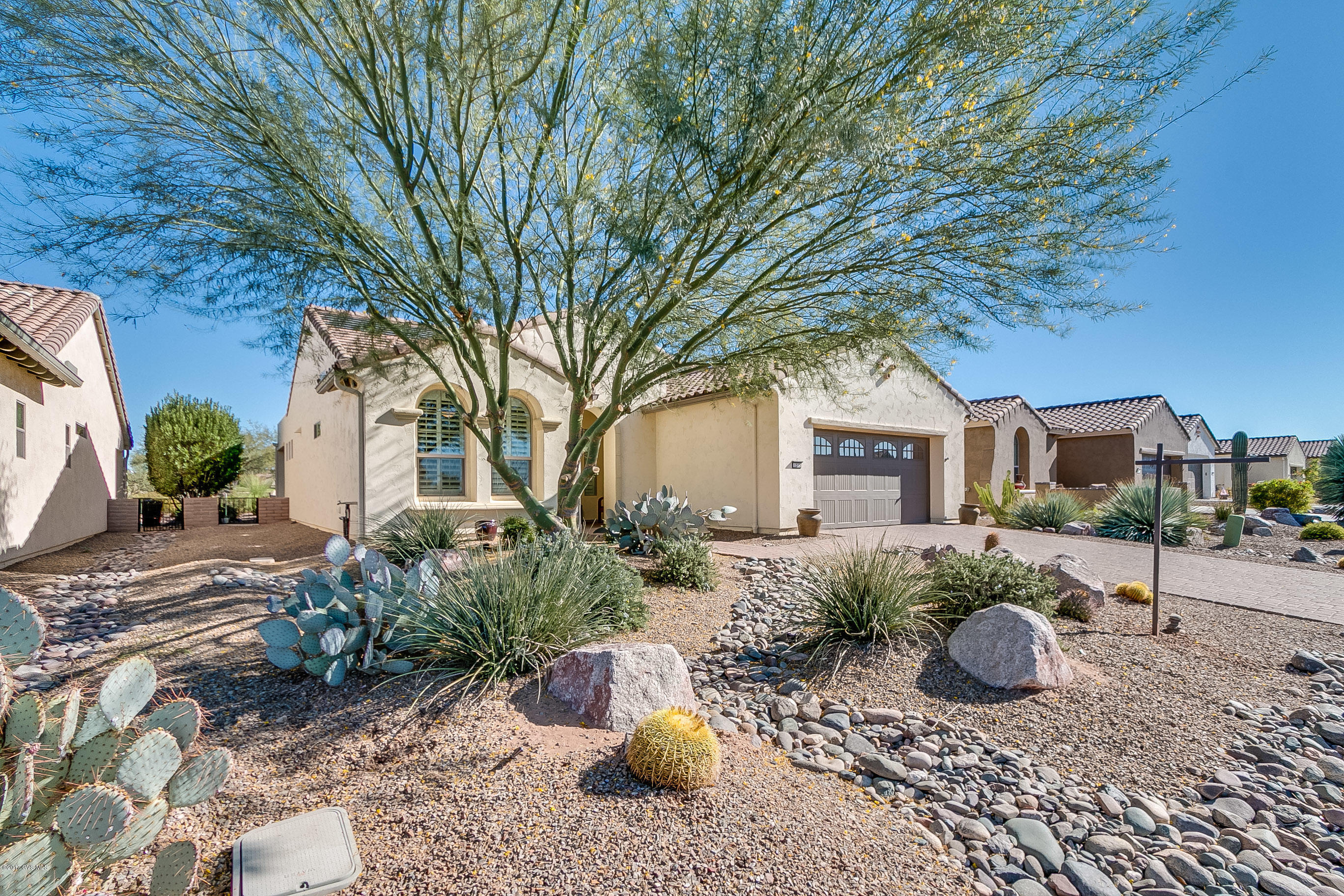 Gorgeous Riva Model in sought after Quail Creek Resort. Located on the 5th green of the Quail Course with wonderful views of the course, Santa Rita Mts & colorful sunrise & Sunsets! This highly upgraded home offers an in-roof solar system, tile flooring throughout, custom lighting & fans, built-in gas grill and seating area, gas fire pit & extended patio w/designer pavers. Community features include 3 nine hole golf courses, resort pool & spa, bocce, tennis & pickle ball courts, arts & technology center, restaurant, club house, fitness center & more!