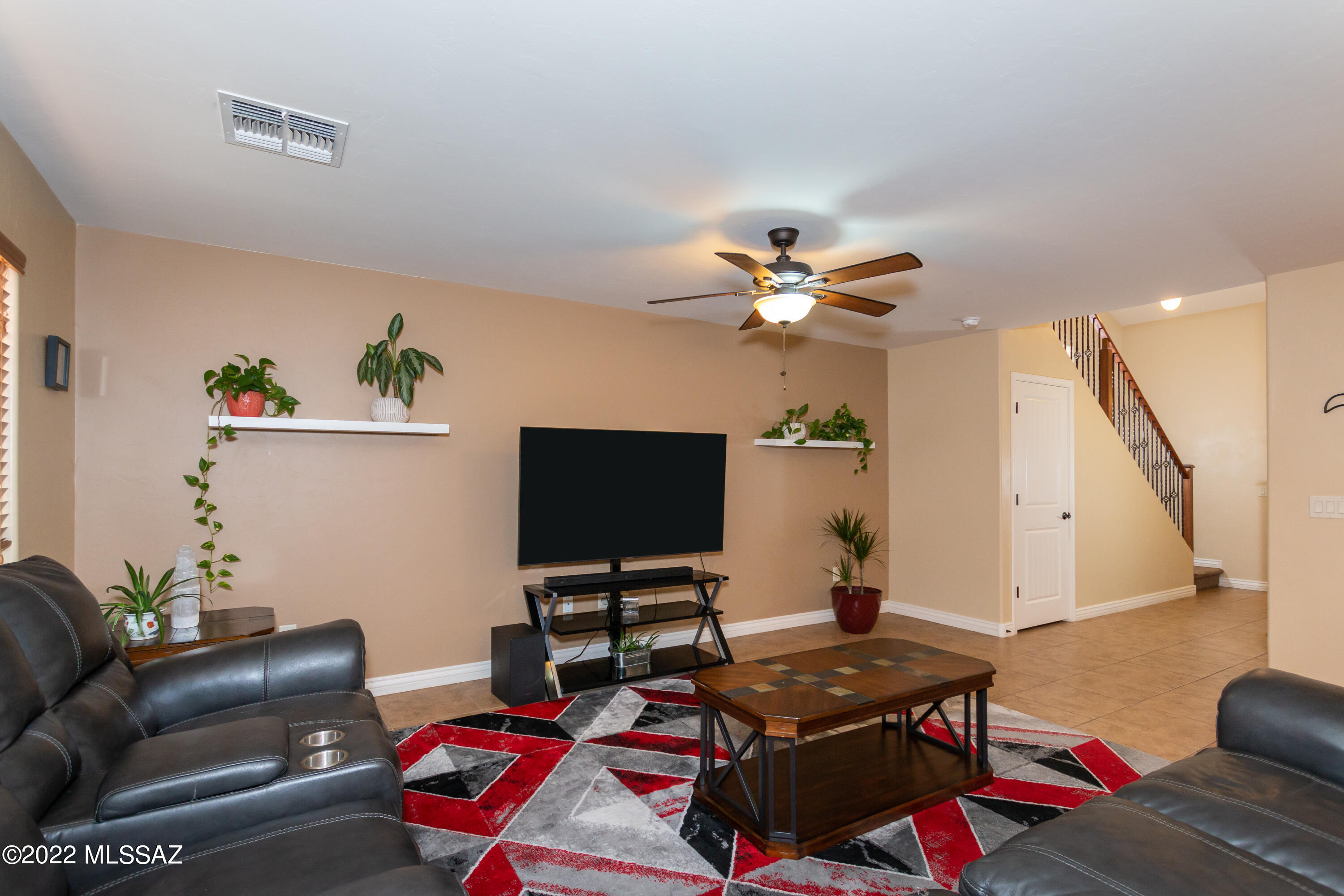 Lovely 2 story home located in the desirable Gated Community of The Pines. This home features a spacious Great Room with open kitchen. In the kitchen you will appreciate the upgraded cabinets, breakfast island, Black appliances, pantry, and dining area. On the main level you will also notice all warm toned tile floors and the convenience of a half bathroom. Upstairs there are 3 Large bedrooms and a bonus loft area which makes a fantastic home office/movie room or added play area. The Primary Suite is open with a spacious bathroom featuring dual vanities, shower tub combo and big walk-in closet. The secondary 2 bedrooms are spacious with an additional large guest bathroom. This home has many upgrades including wood & metal stair rails, fully landscaped easy-care backyard and leased solar for low electric bills. All this is conveniently located near golf, parks, community pool, shopping, schools, and I-10. Do not miss this fabulous home!!